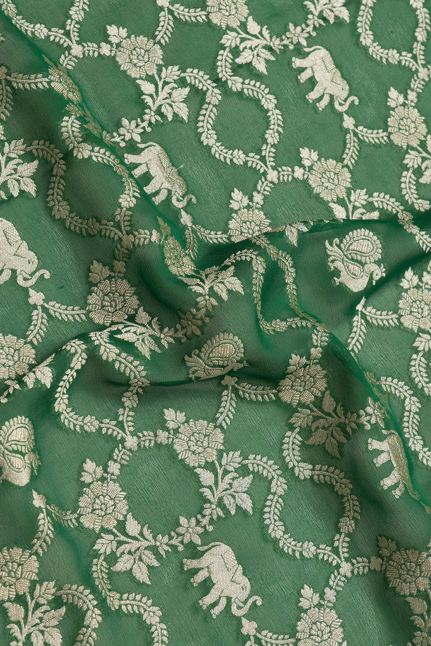 Close up of Bottle Green Dual Tone Mysore Georgette Saree with Zari Brocade on the body and Zari Border.  displaying folds