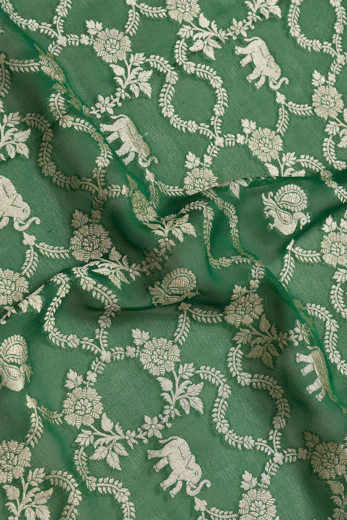 Close up of Bottle Green Dual Tone Mysore Georgette Saree with Zari Brocade on the body and Zari Border.  displaying folds