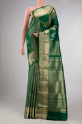 Green Kanchipuram Silk Saree with Stripes on the body and Zari Border displayed on a mannequin