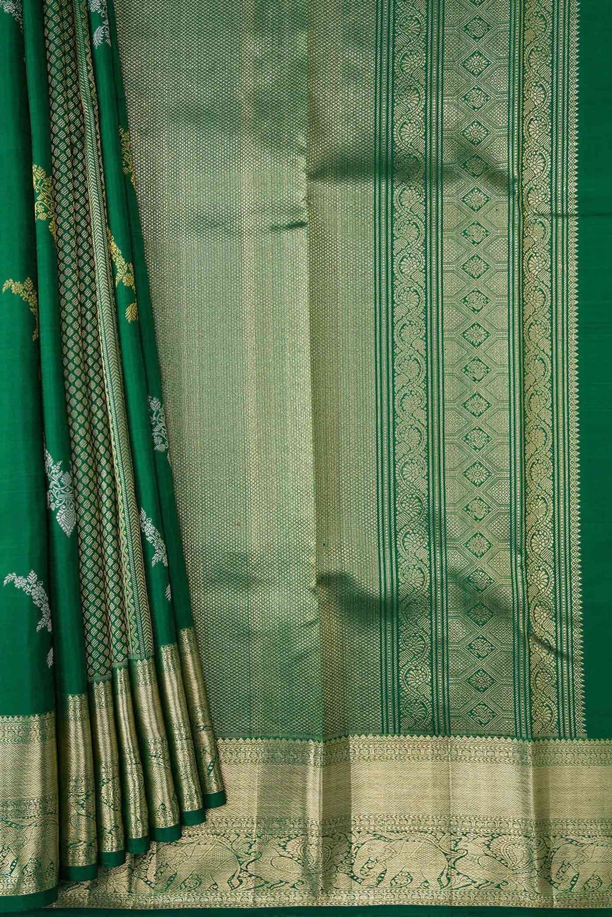 Pleats and pallu of Green Kanchipuram Silk Saree with Stripes on the body and Zari Border