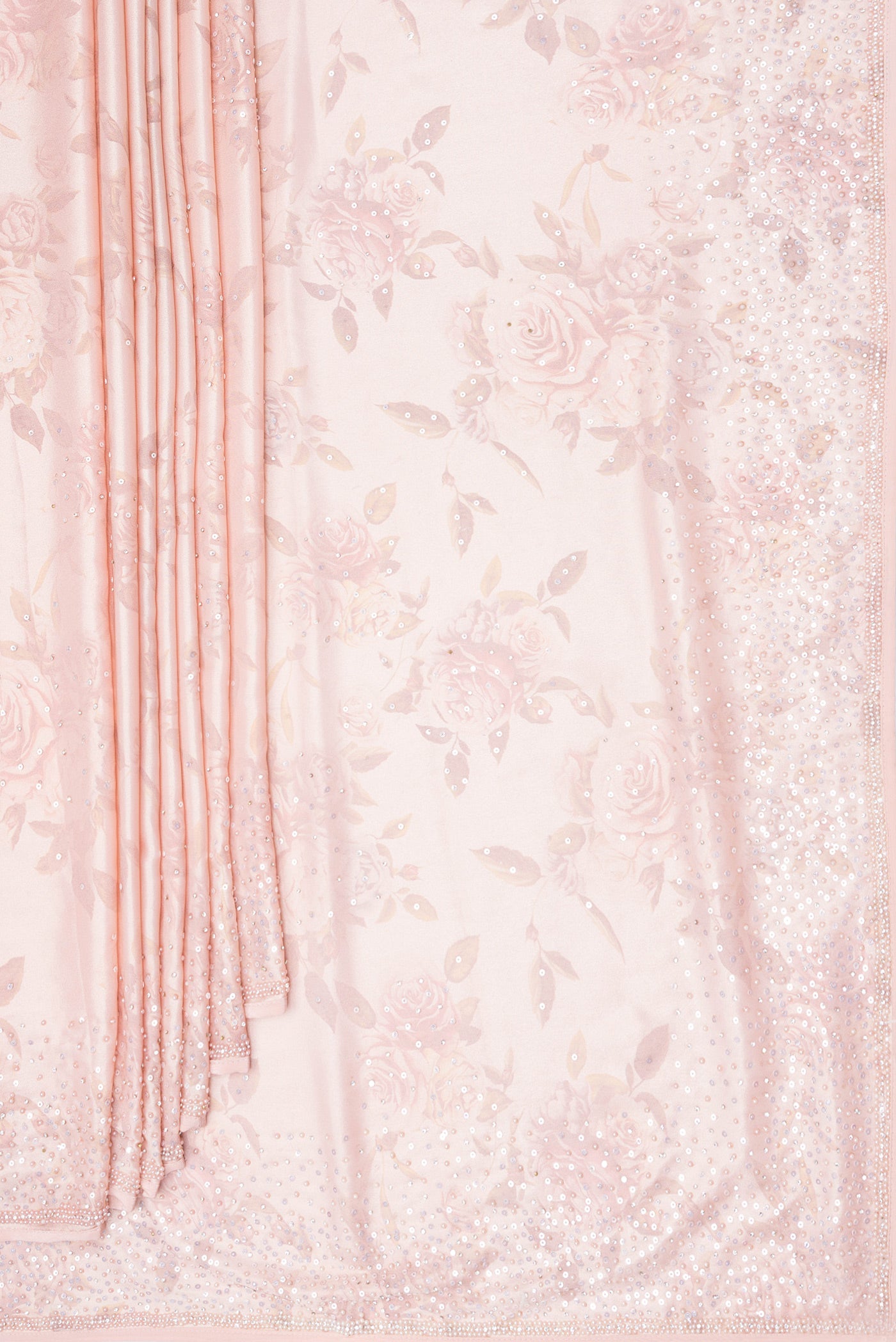 Pleats and pallu of Rose Gold Dual Tone Georgette Saree with Embroidery on the body and Embroidery Border. 