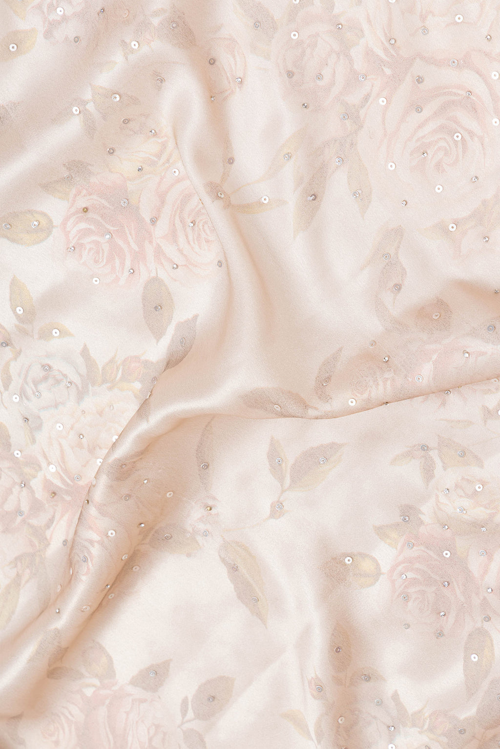 Close up of Rose Gold Dual Tone Mysore Crepe Saree with Embroidery on the body and Embroidery Border.  displaying folds