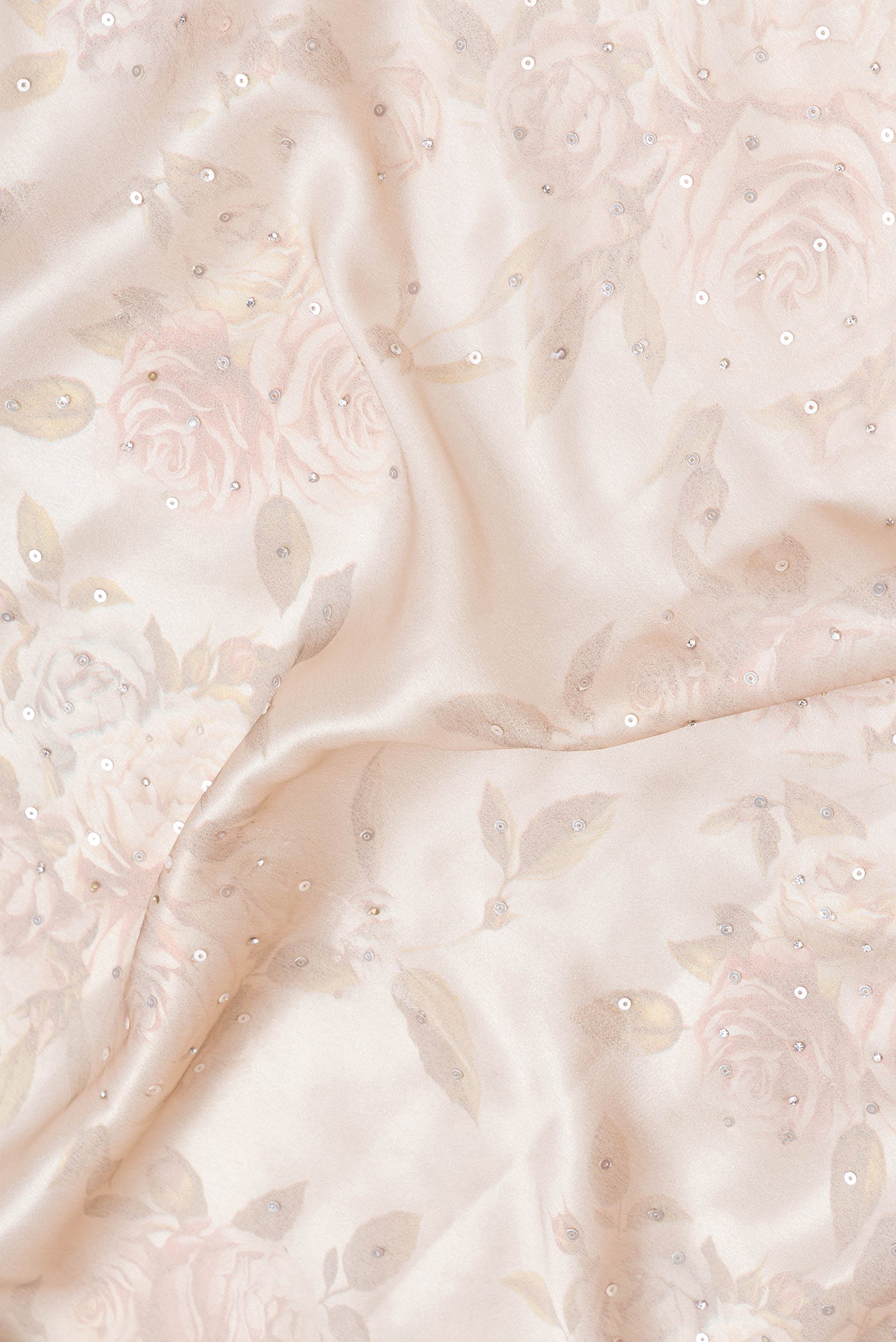 Close up of Rose Gold Dual Tone Mysore Crepe Saree with Embroidery on the body and Embroidery Border.  displaying folds