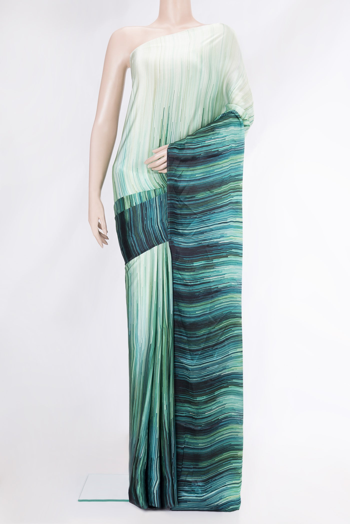 Light Green Dual Tone Mysore Crepe Saree with Printed design on the body and Printed Border.  displayed on a mannequin