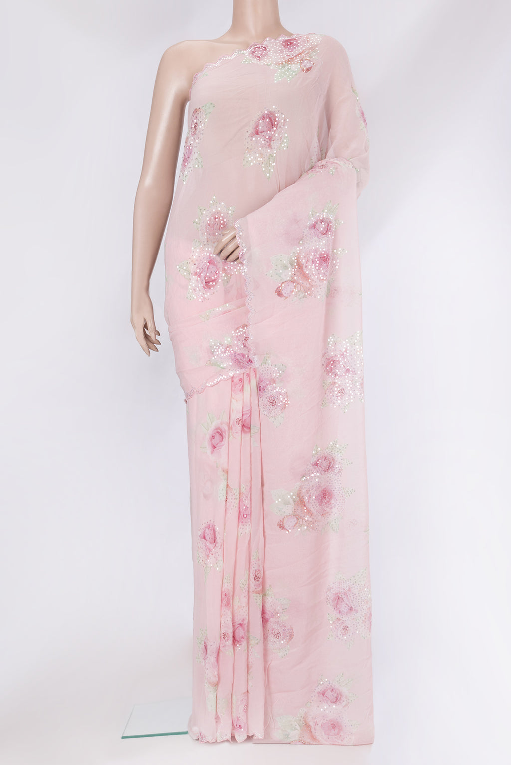 Pink Georgette Saree with Embroidery on the body and Embroidery Border.  displayed on a mannequin