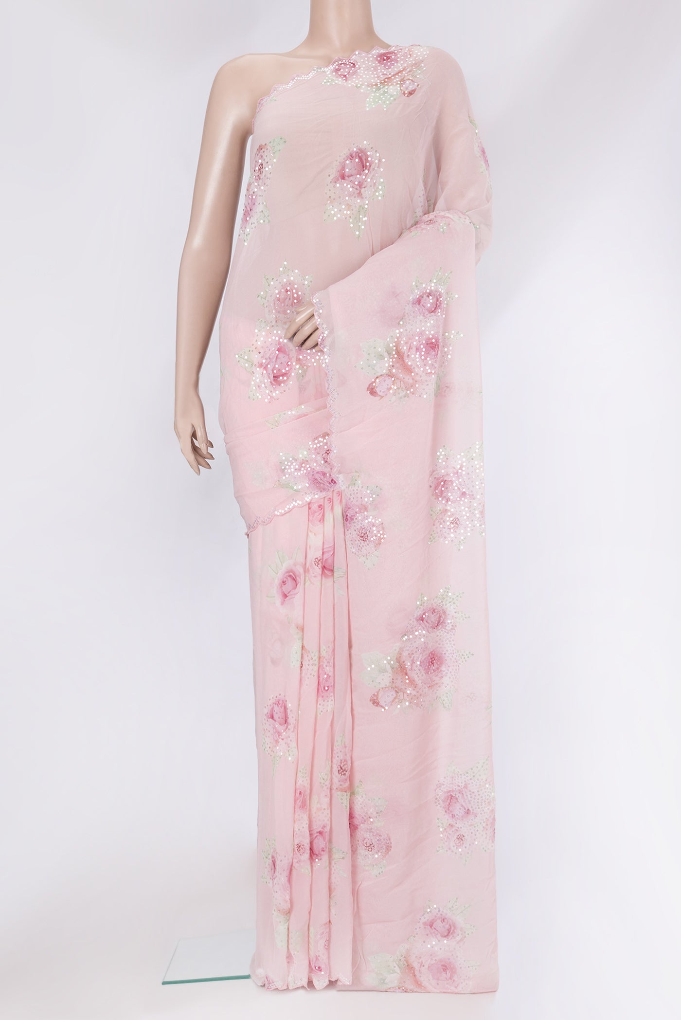 Pink Georgette Saree with Embroidery on the body and Embroidery Border.  displayed on a mannequin