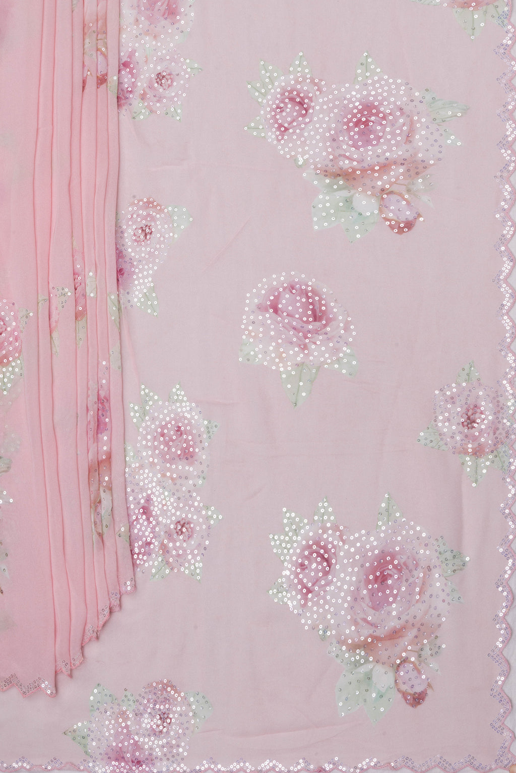 Pleats and pallu of Pink Georgette Saree with Embroidery on the body and Embroidery Border. 
