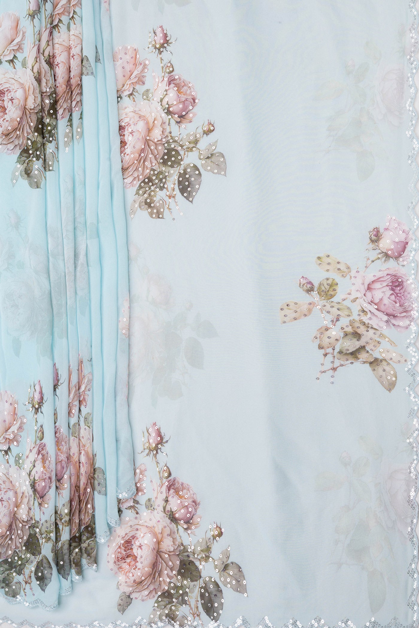 Pleats and pallu of Sky Blue Dual Tone Georgette Saree with Embroidery on the body and Embroidery Border. 