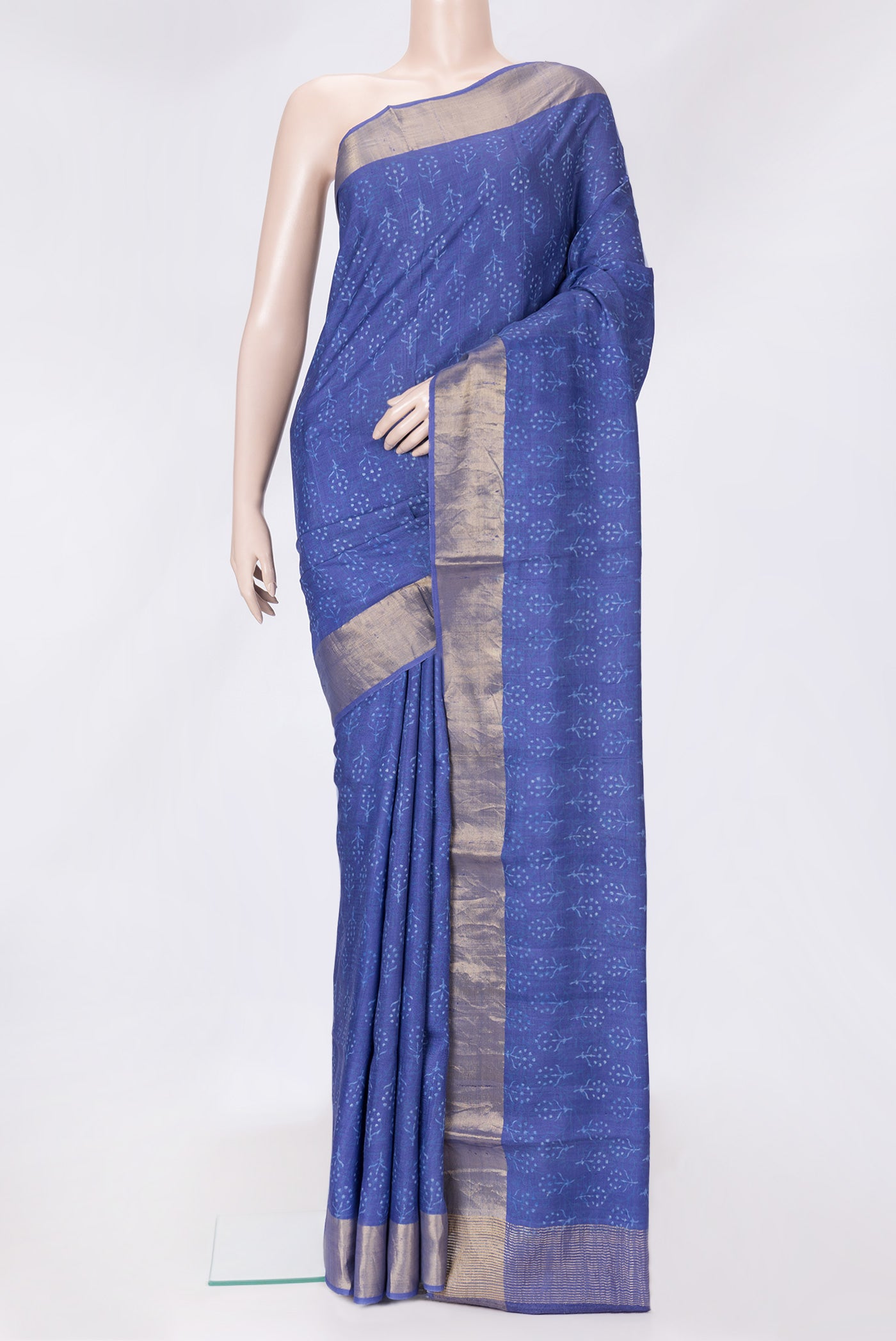 Navy Blue Dual Tone Tussar Silk Saree with Printed design on the body and Zari Border.  displayed on a mannequin