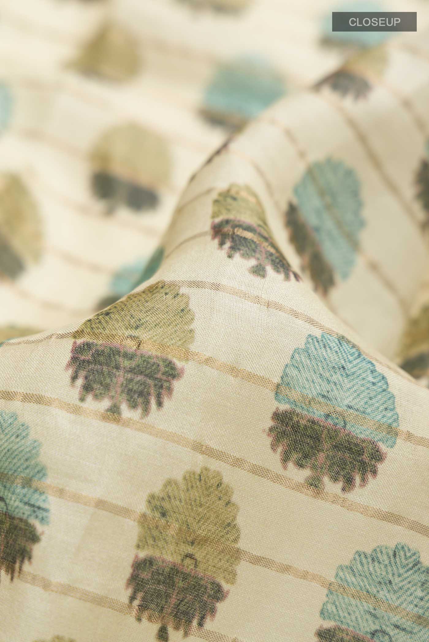 Close up of Green Bhagalpuri Tussar Silk Saree with Printed design on the body and Zari Border displaying folds
