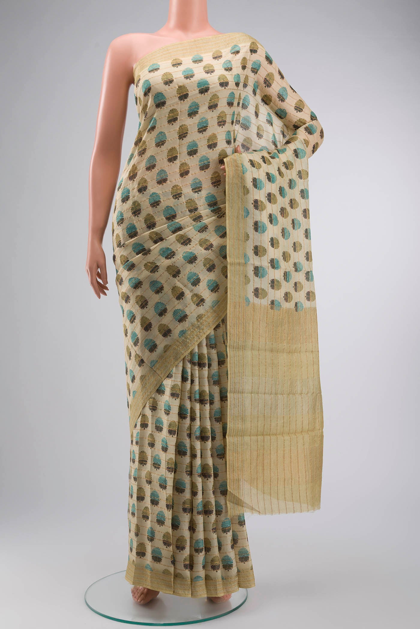 Green Bhagalpuri Tussar Silk Saree with Printed design on the body and Zari Border displayed on a mannequin
