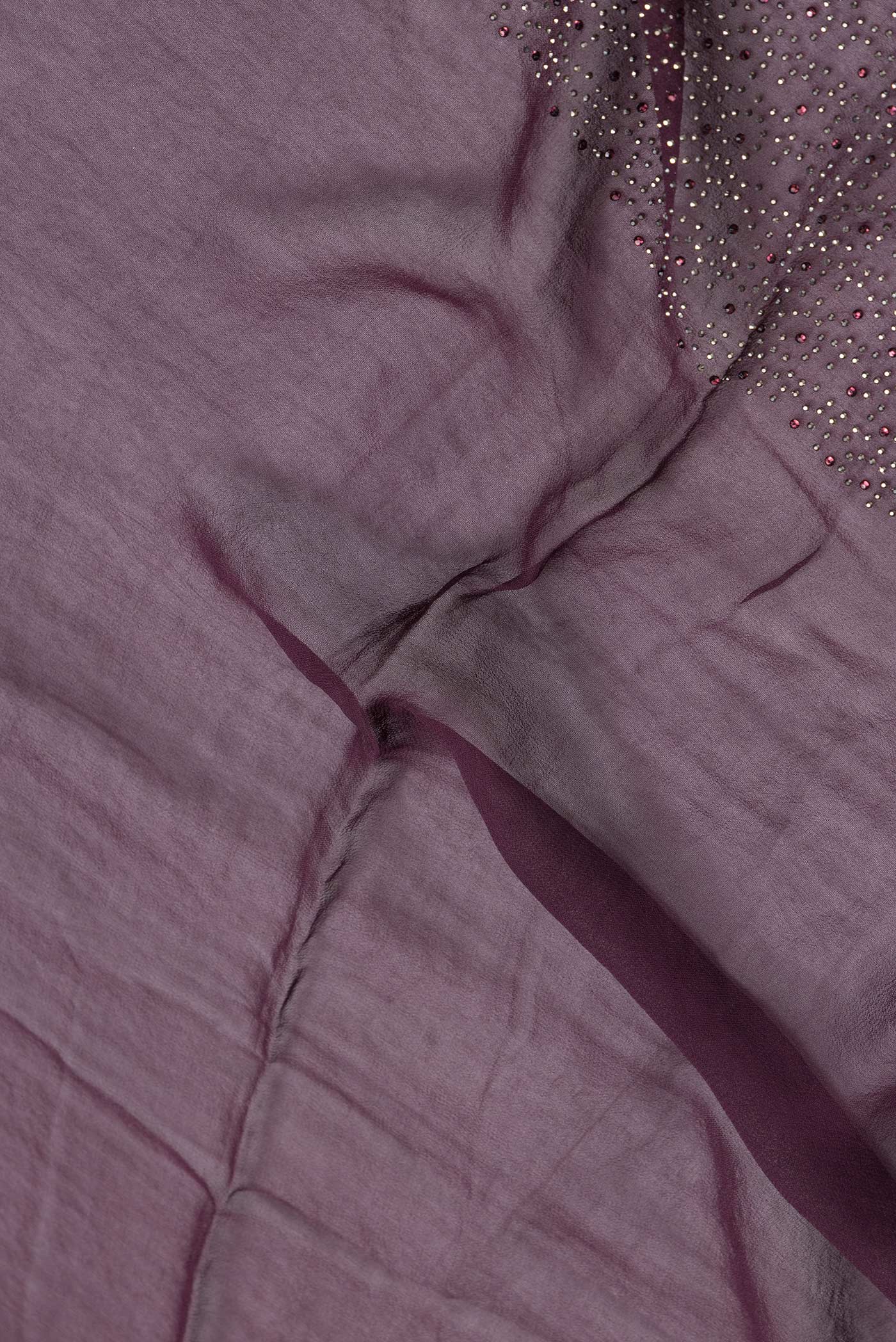 Close up of Burgundy Dual Tone Mysore Georgette Saree with Embroidery on the body and Sequin Border.  displaying folds