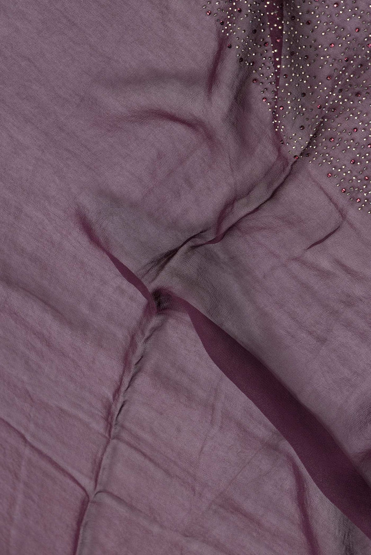 Close up of Burgundy Dual Tone Mysore Georgette Saree with Embroidery on the body and Sequin Border.  displaying folds