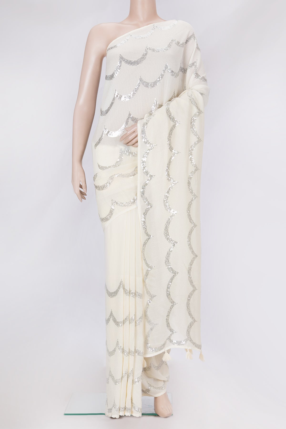 Beige Dual Tone Mysore Georgette Saree with Embroidery on the body and Without Border.  displayed on a mannequin