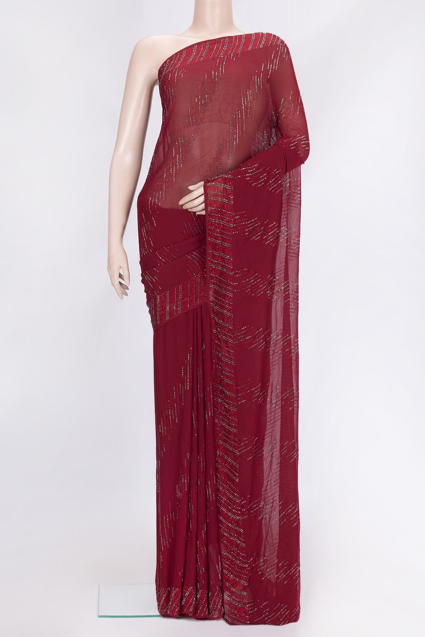 Maroon Dual Tone Georgette Saree with Embroidery on the body and Embroidery Border.  displayed on a mannequin