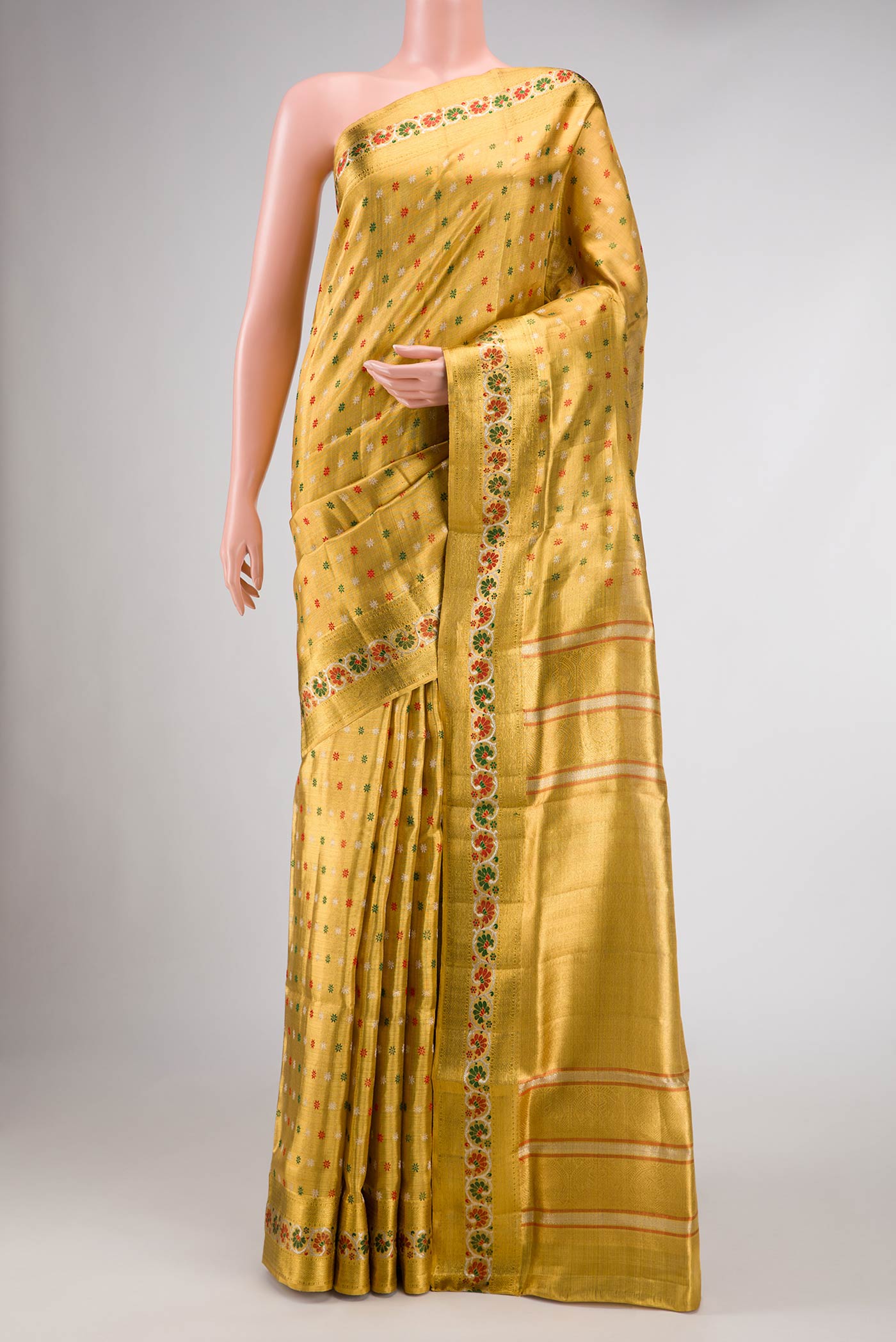 Gold Dual Tone Kanjivaram Tissue Silk Saree with Zari Brocade on the body and Zari Border.  displayed on a mannequin