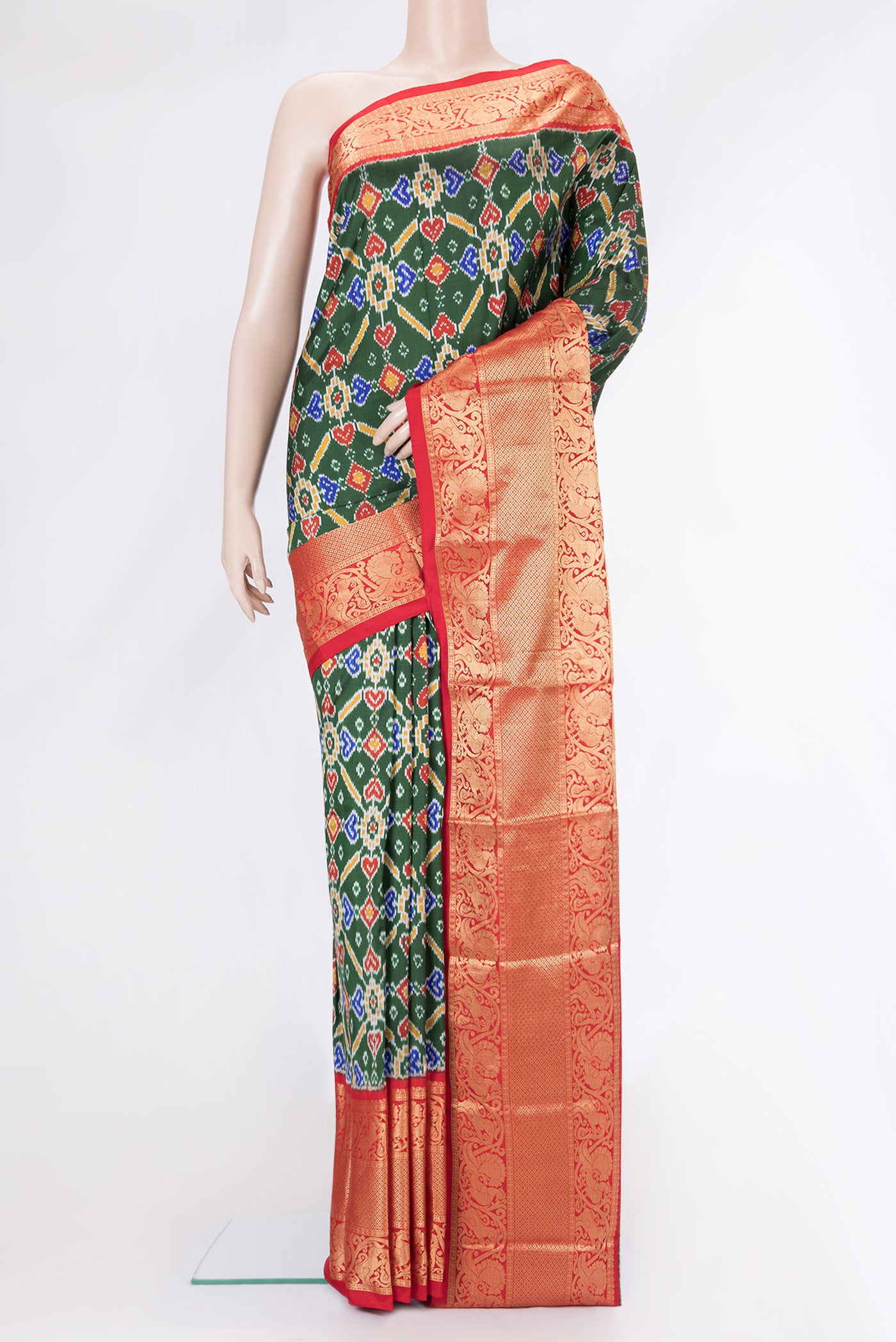 Bottle Green Dual Tone Kanchipuram Silk Saree with Ikat Print on the body and Zari Border.  displayed on a mannequin