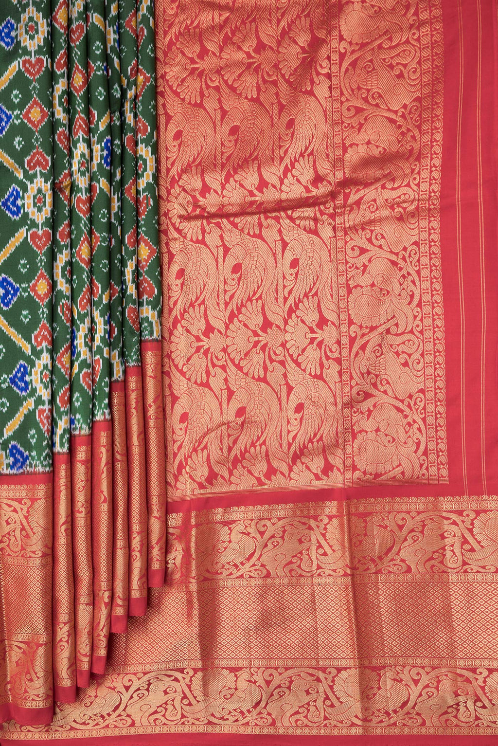 Pleats and pallu of Bottle Green Dual Tone Kanchipuram Silk Saree with Ikat Print on the body and Zari Border. 