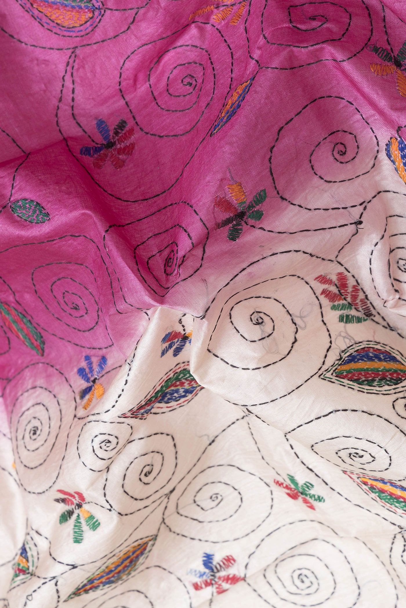 Close up of Pink Dual Tone Tussar Silk Saree with Embroidery on the body and Embroidery Border.  displaying folds