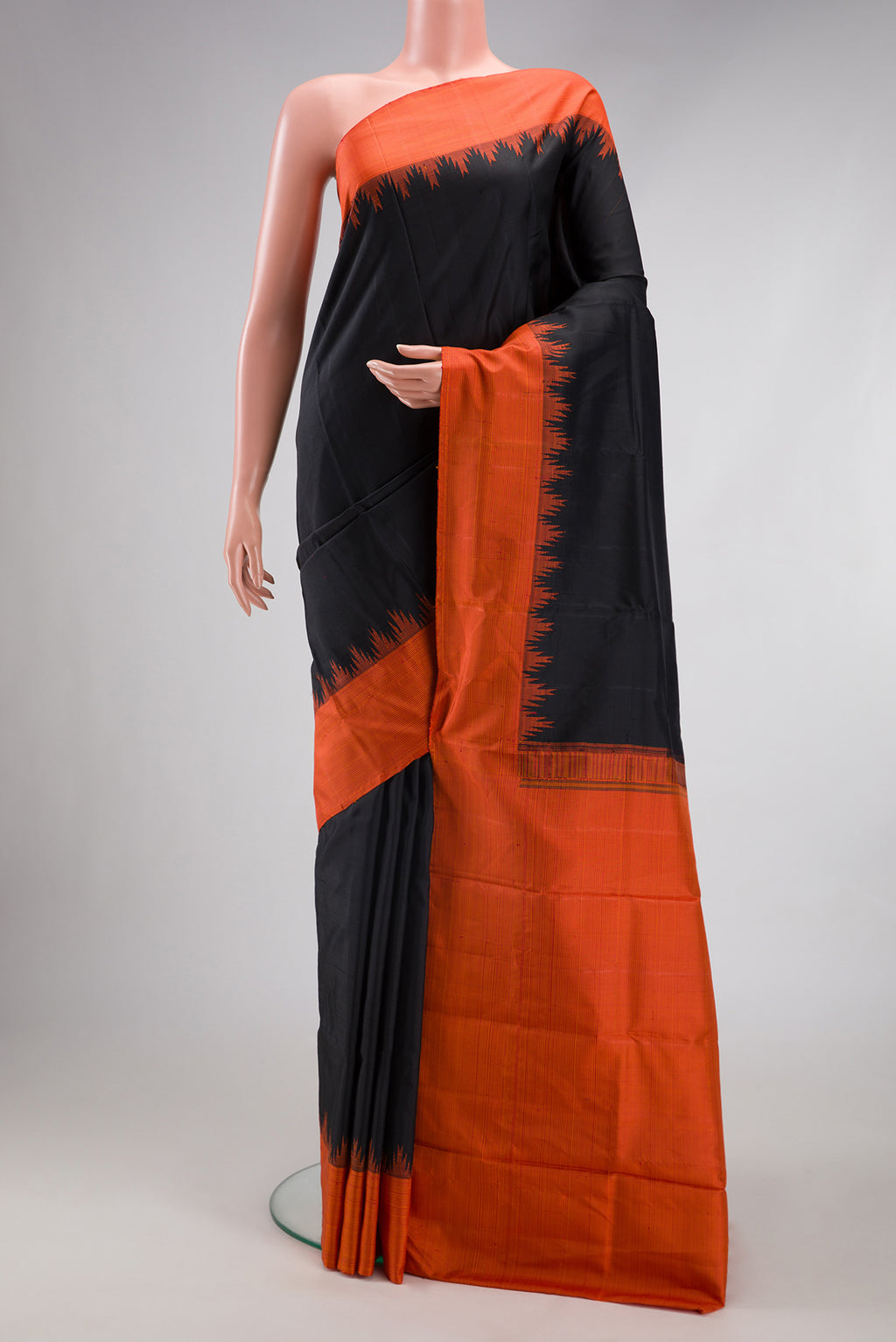 Black Kanjivaram Silk Saree with Plain Body and Temple Border.  displayed on a mannequin