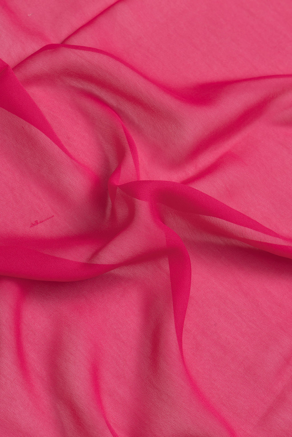 Close up of Dark Pink Dual Tone Georgette Saree with Plain Body and Zari Border.  displaying folds
