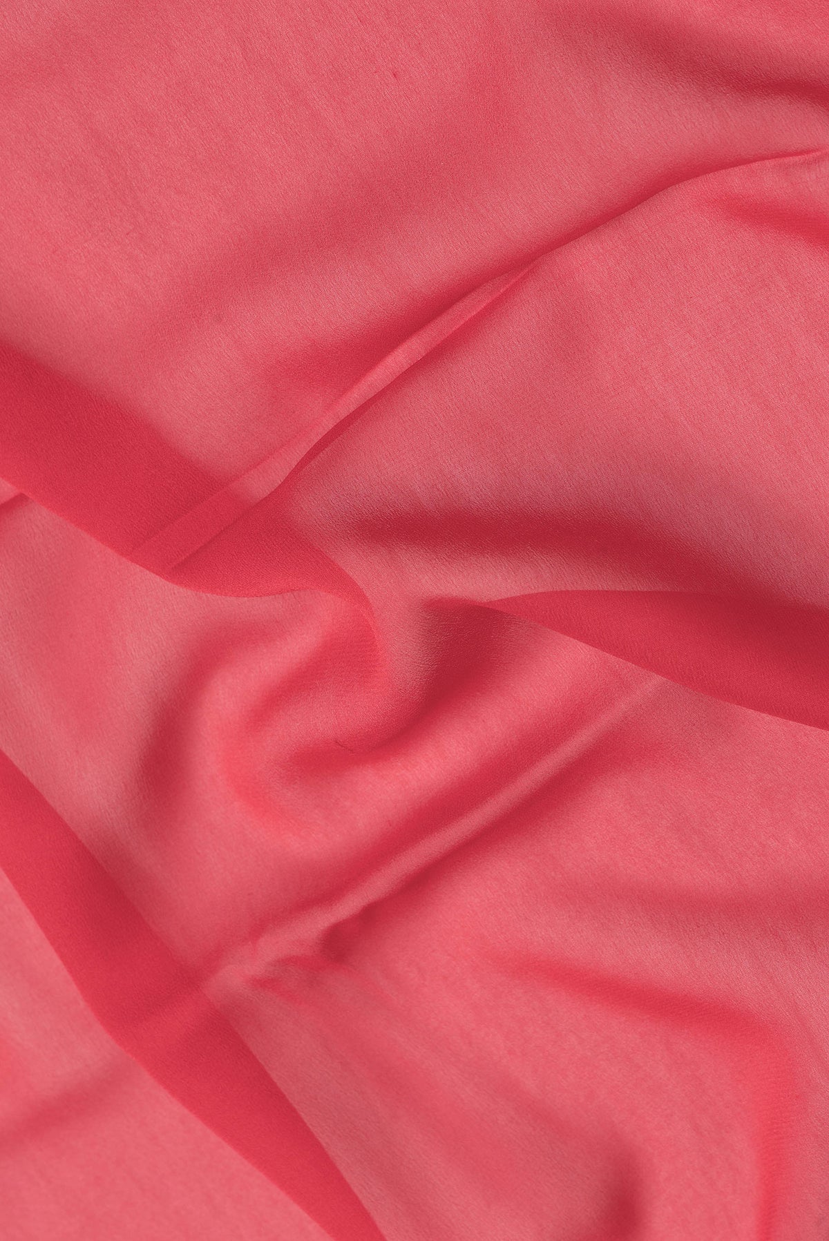 Close up of Red Dual Tone Georgette Saree with Plain Body and Zari Border.  displaying folds