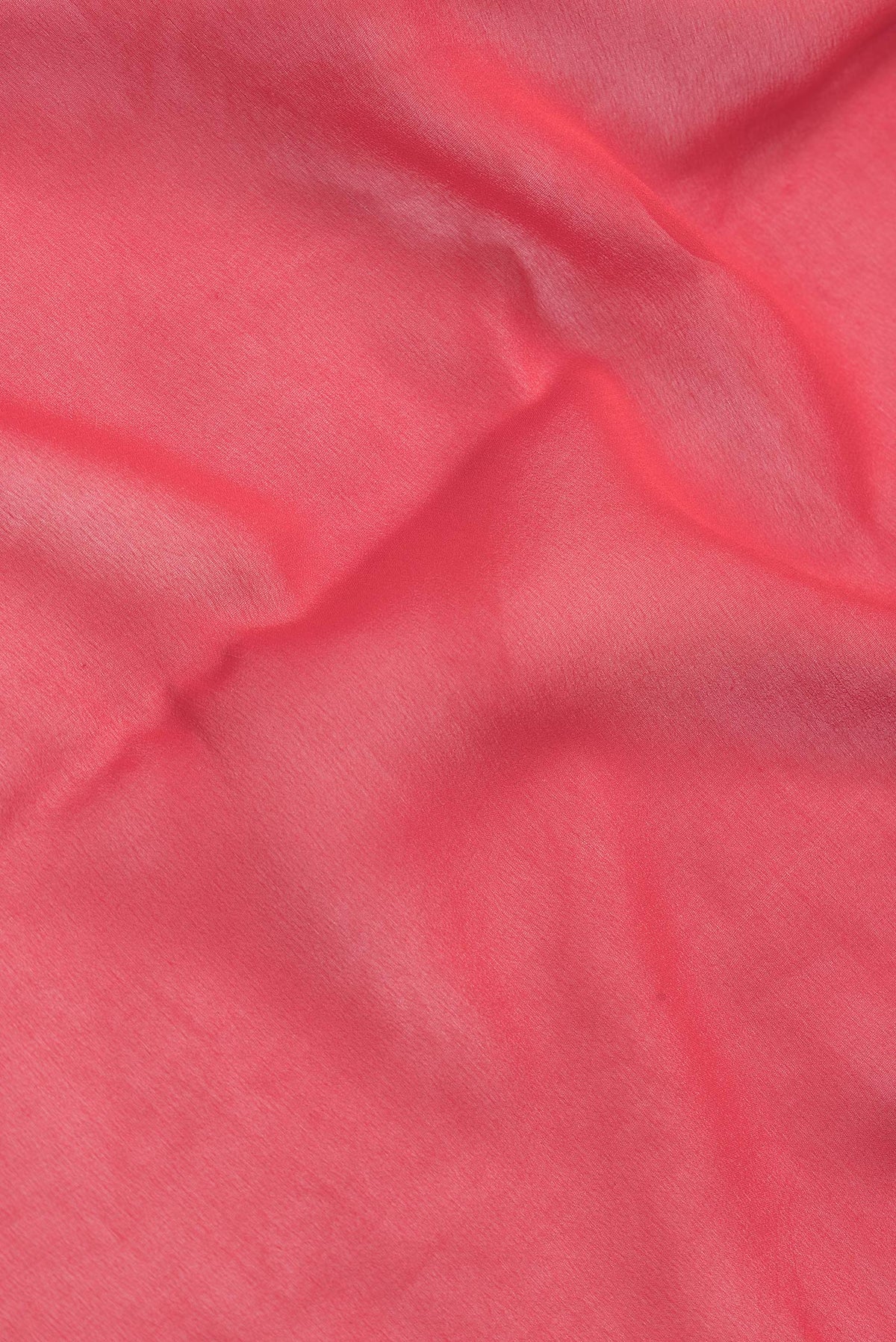Close up of Red Dual Tone Mysore Georgette Saree with Plain Body and Zari Border.  displaying folds