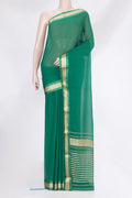Green Mysore Georgette Saree with Plain Body and Zari Border.  displayed on a mannequin
