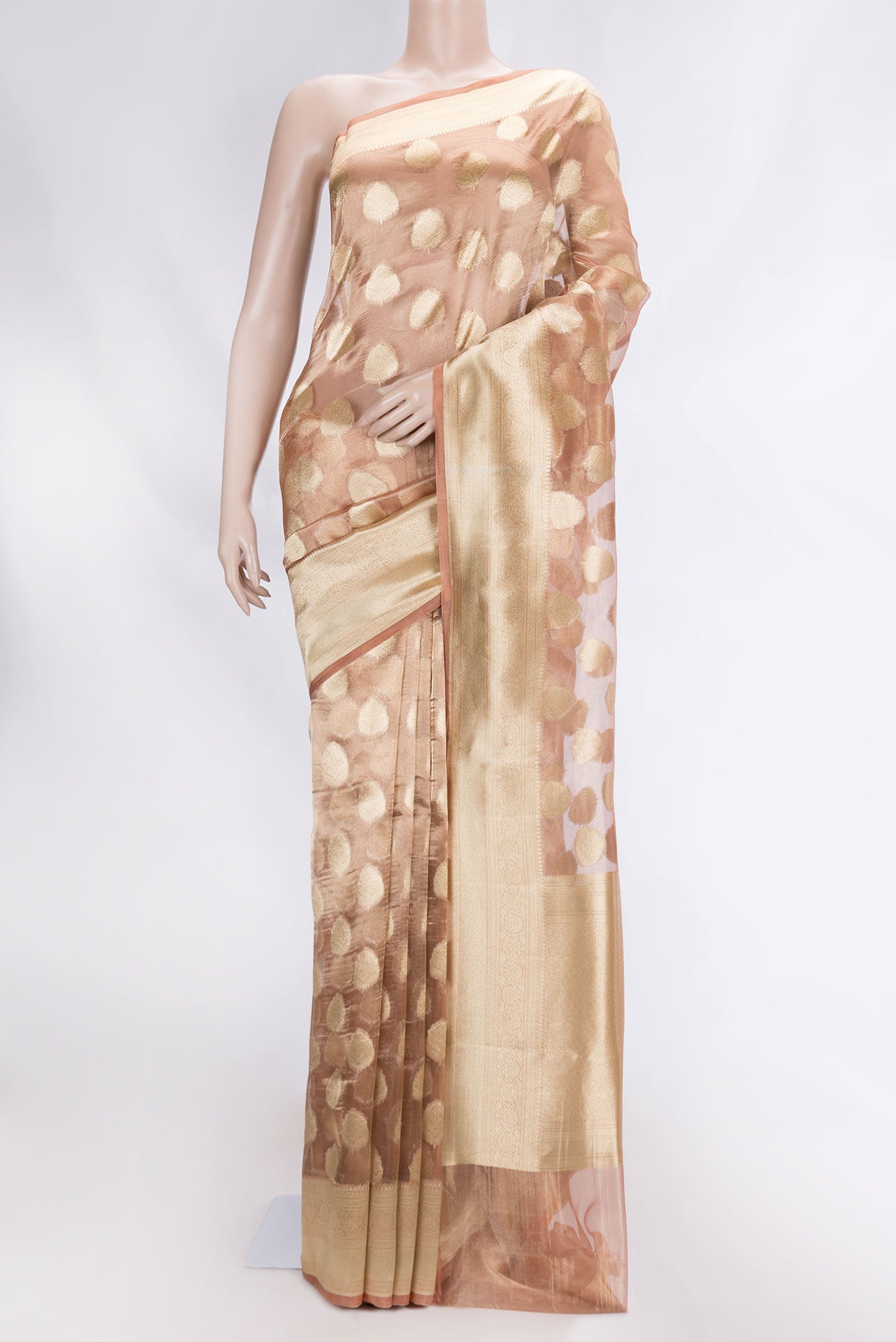 Brown Organza Silk Saree with Zari Butta on the body and Zari Border displayed on a mannequin