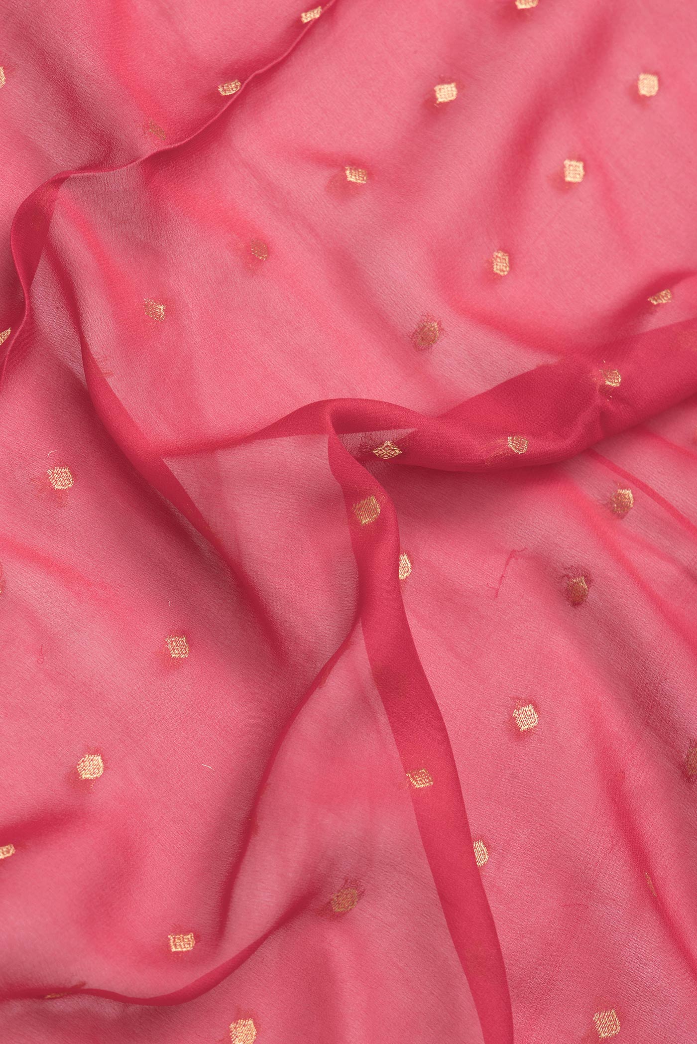 Close up of Pink Dual Tone Mysore Georgette Saree with Zari Butta on the body and Fancy Border.  displaying folds