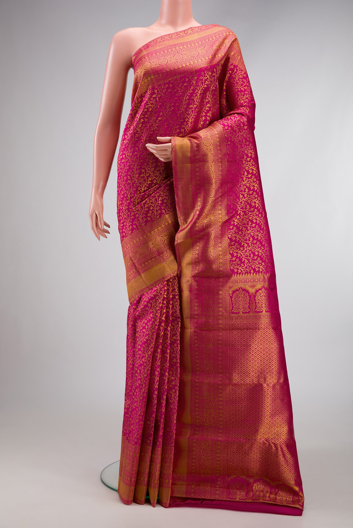 Magenta Dual Tone Kanchipuram Silk Saree with Zari Brocade on the body and Zari Border.  displayed on a mannequin