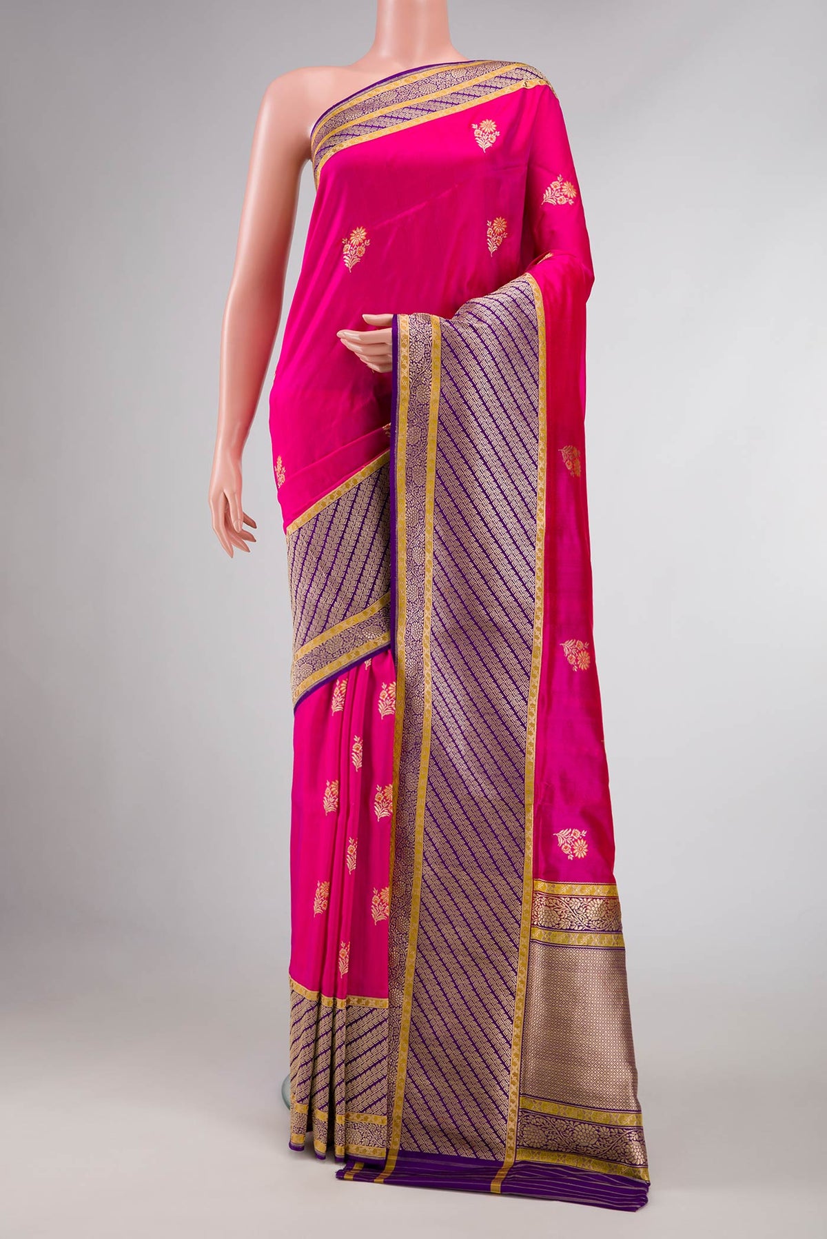 Pure Silk Pure Zari Pink Dual Tone Banarasi Saree with Zari And Thread Butta on the body and Zari Border displayed on a mannequin