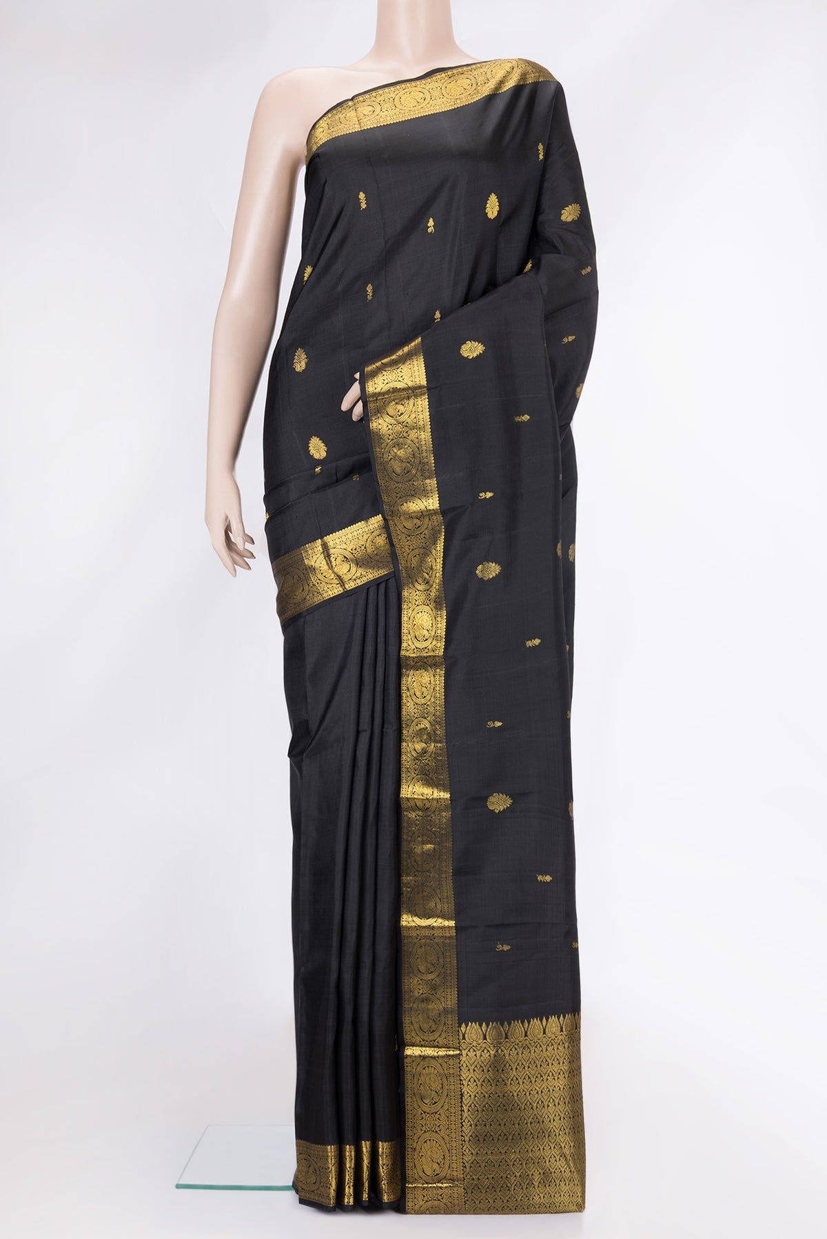 Black Dual Tone Kanjivaram Silk Saree with Zari Butta on the body and Zari Border.  displayed on a mannequin