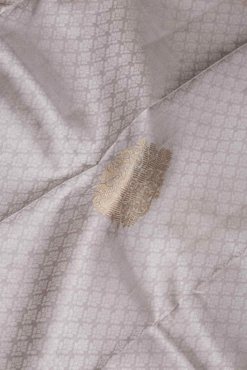 Close up of Grey Dual Tone Kanchipuram Silk Saree with Jacquard With Zari Butta on the body and Zari Border displaying folds