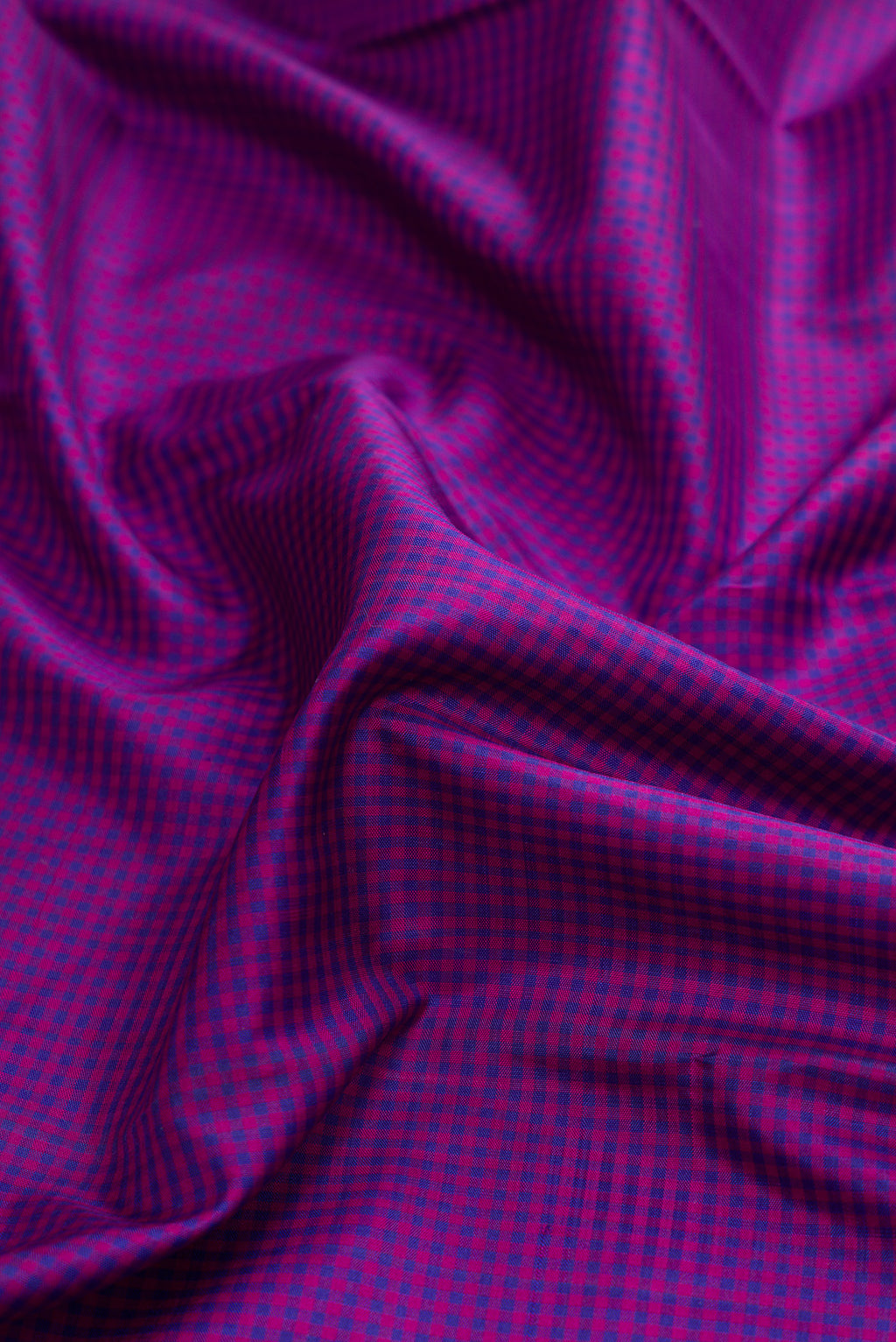 Close up of Pure Silk Pure Zari Purple Dual Tone Kanchipuram Saree with Checked design on the body and Temple Border.  displaying folds