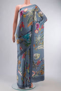 Blue Satin Silk Saree with Printed design on the body and Plain Border displayed on a mannequin