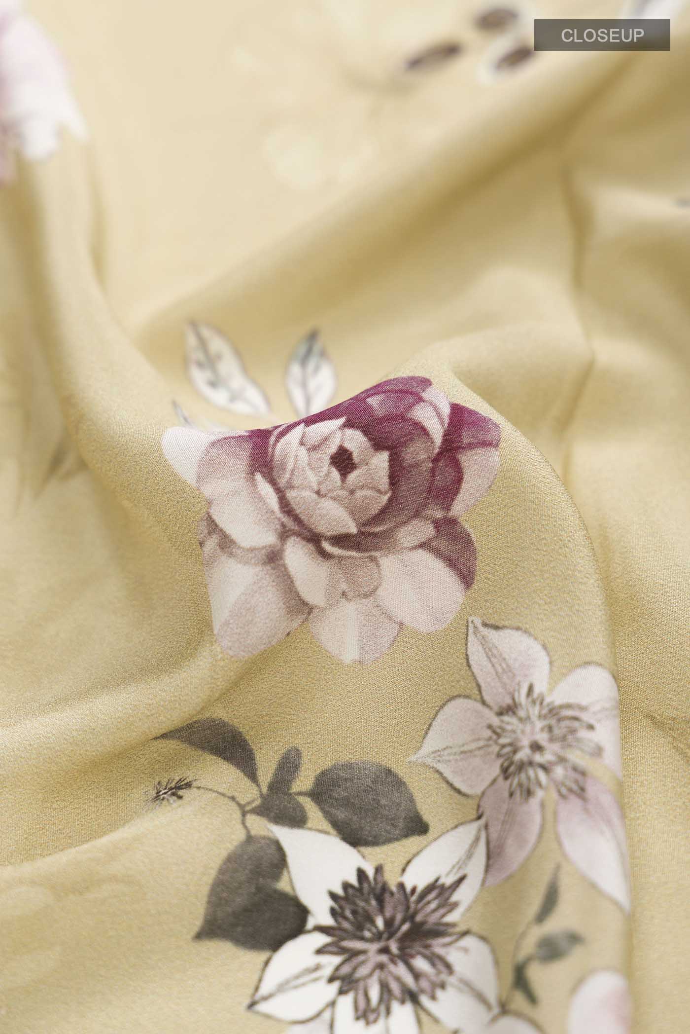 Close up of Beige Mysore Crepe Saree with Floral Print on the body and Plain Border displaying folds