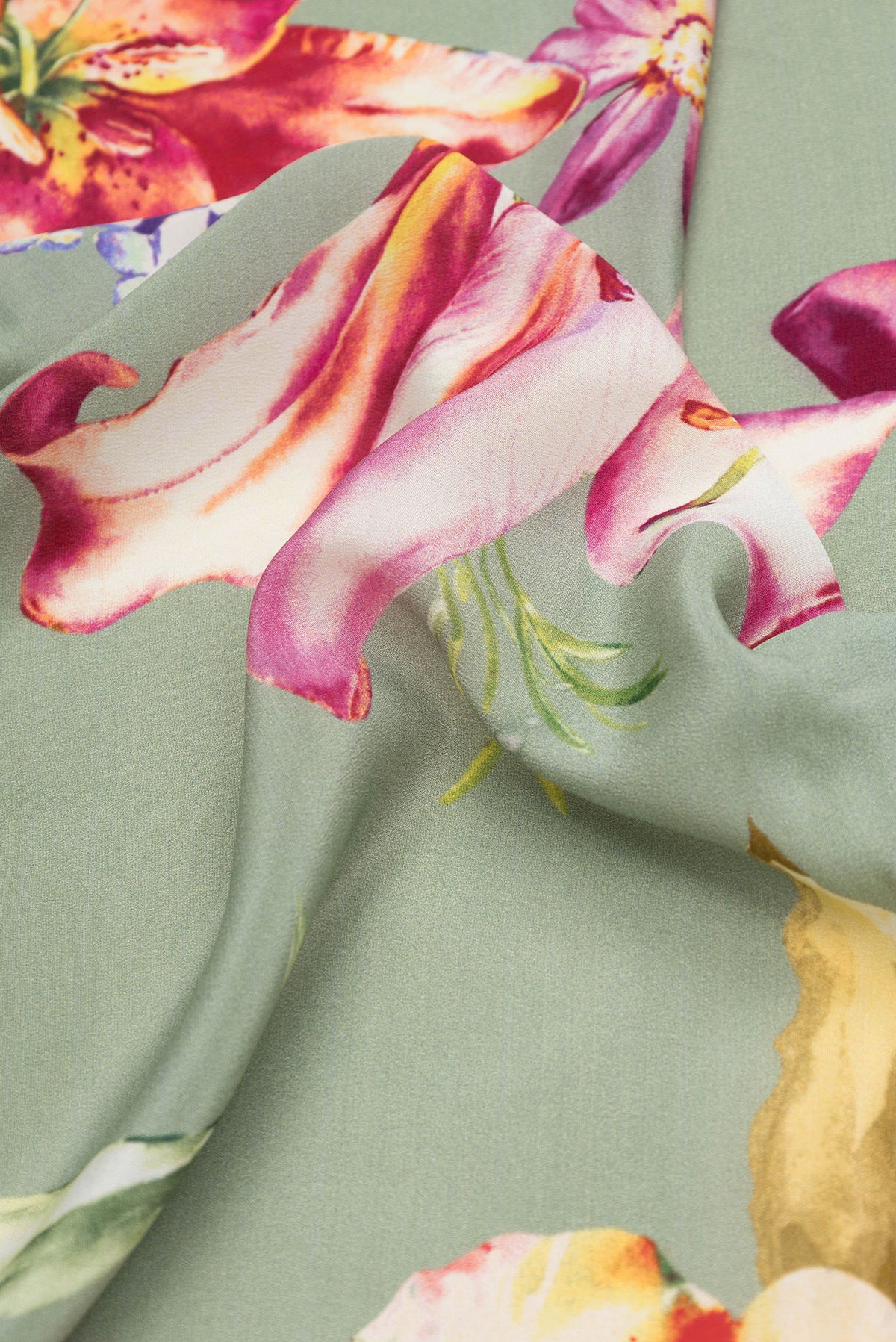 Close up of Pista Green Dual Tone Mysore Crepe Saree with Printed design on the body and Without Border.  displaying folds