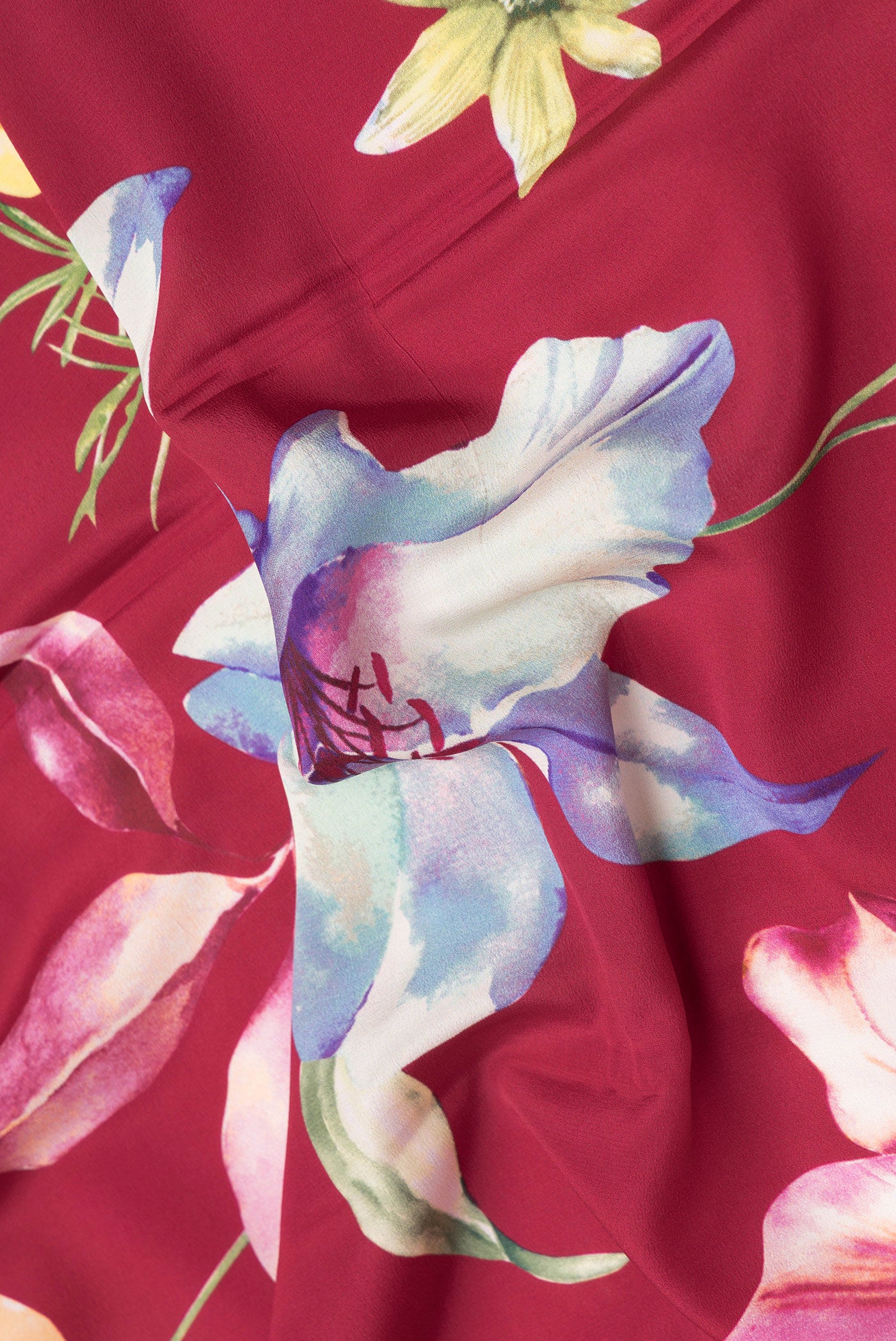 Close up of Maroon Dual Tone Mysore Crepe Saree with Printed design on the body and Plain Border.  displaying folds