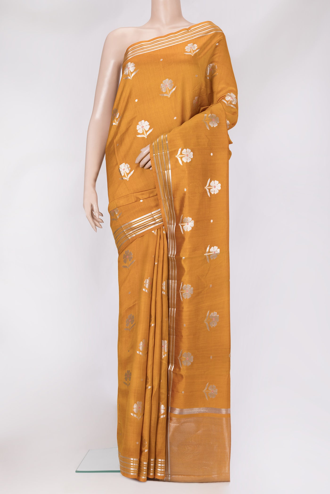 Mustard Dual Tone Tussar Silk Saree with Zari Butta on the body and Zari Border.  displayed on a mannequin