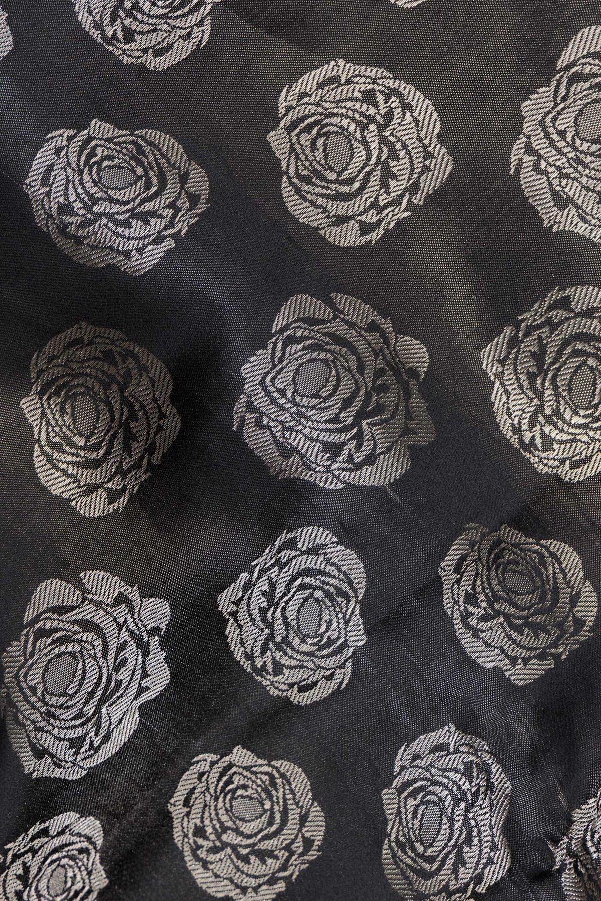 Close up of Pure Silk Black Banarasi Saree with Zari Brocade on the body and Fancy Border.  displaying folds