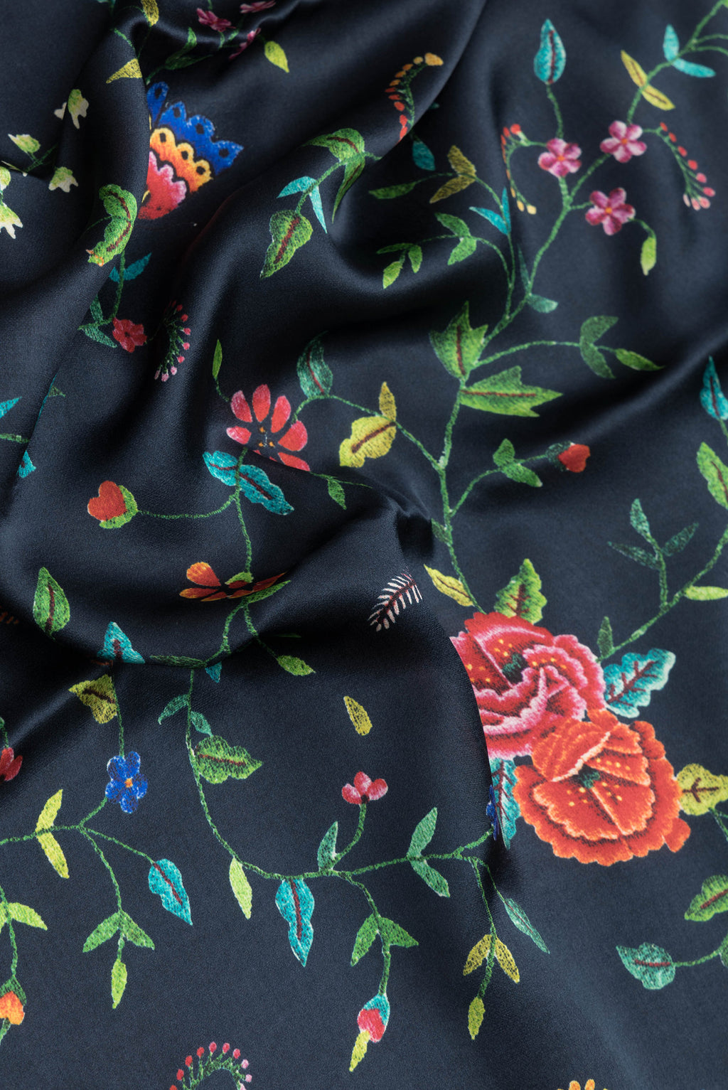 Close up of Navy Blue Dual Tone Mysore Crepe Saree with Printed design on the body and Printed Border.  displaying folds