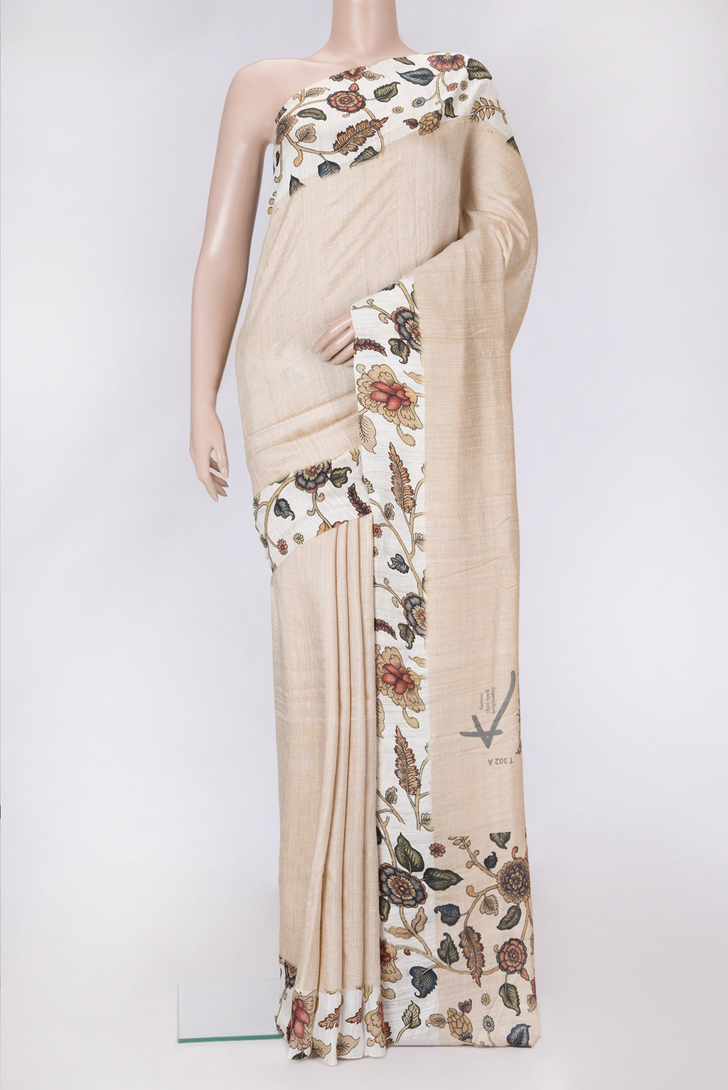 Beige Dual Tone Tussar Silk Saree with Plain Body and Printed Border.  displayed on a mannequin