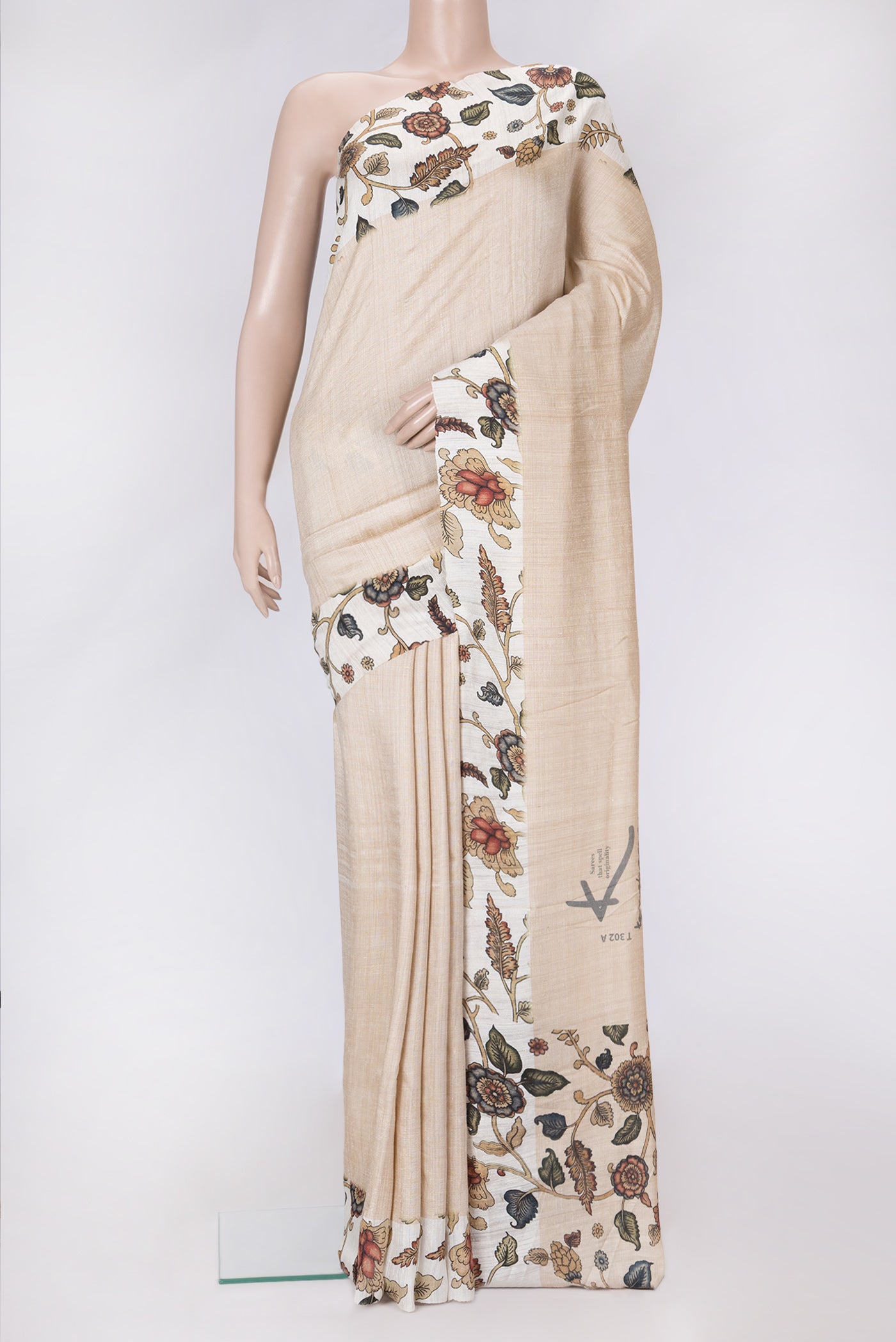 Beige Dual Tone Tussar Silk Saree with Plain Body and Printed Border.  displayed on a mannequin