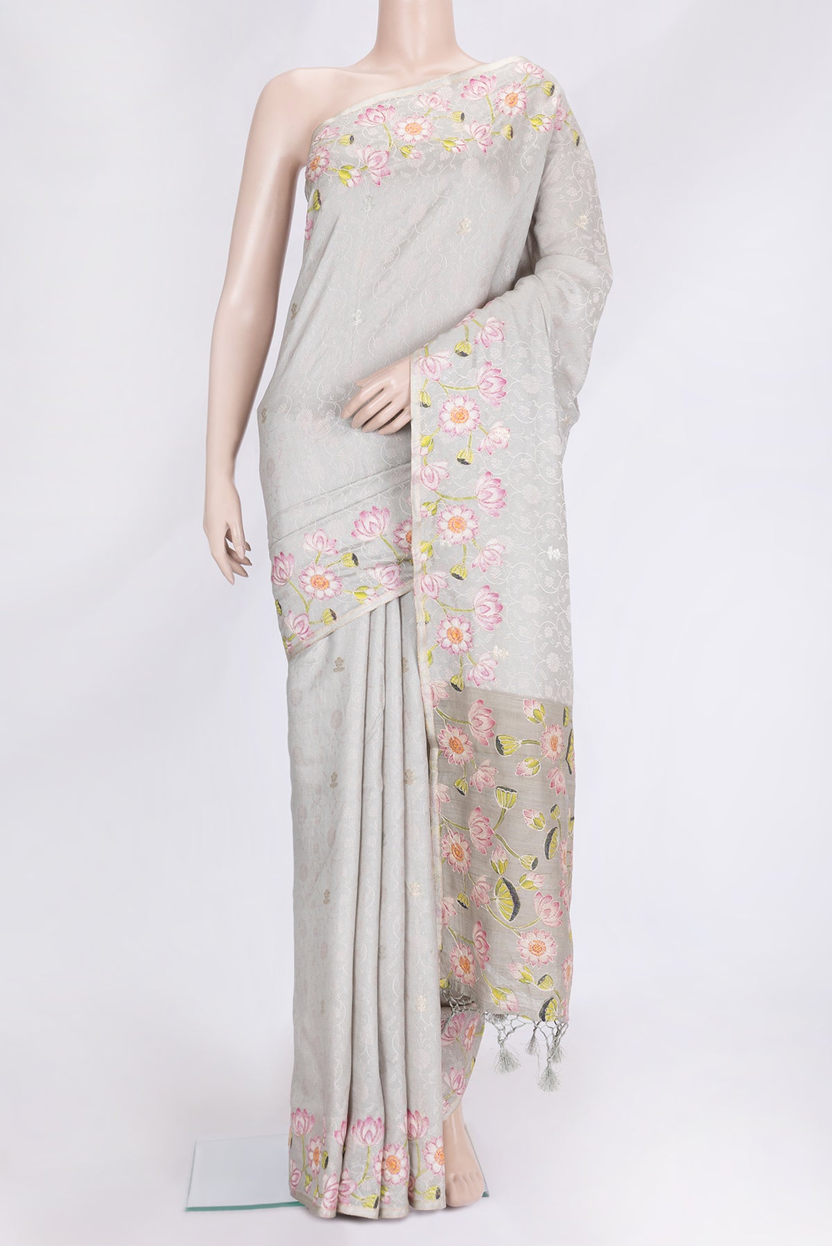 Grey Dual Tone Tussar Silk Saree with Jacquard design on the body and Thin Zari Line.  displayed on a mannequin