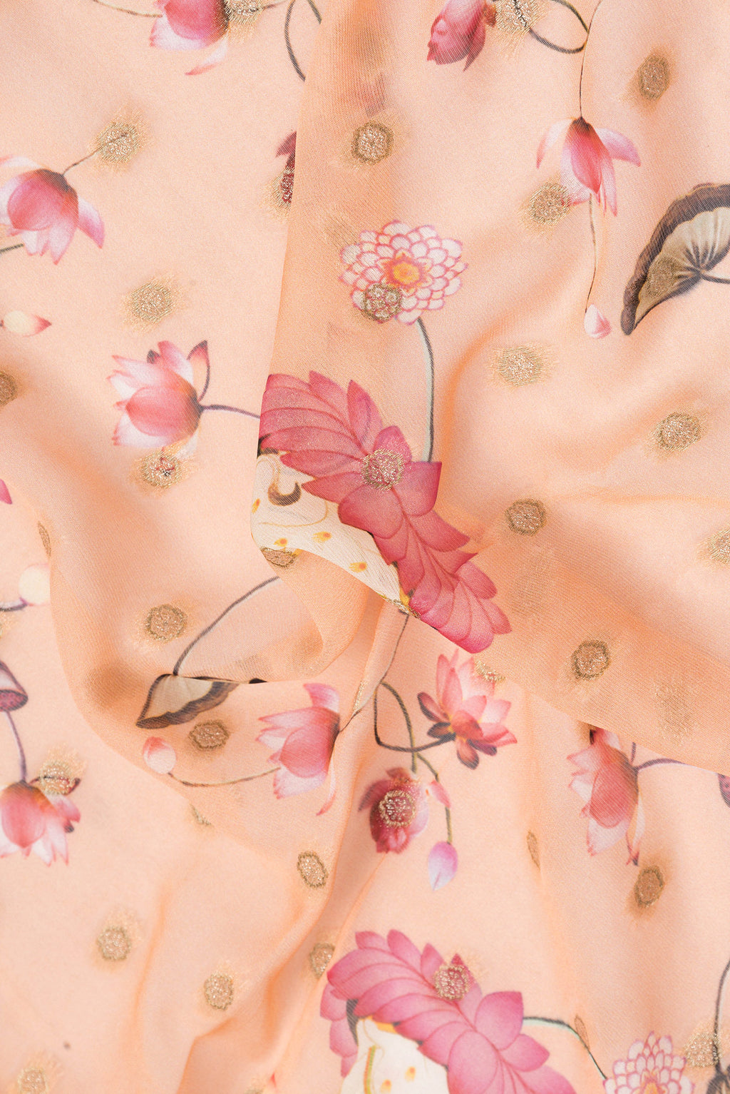 Close up of Peach Dual Tone Georgette Saree with Embroidery on the body and Embroidery Border.  displaying folds