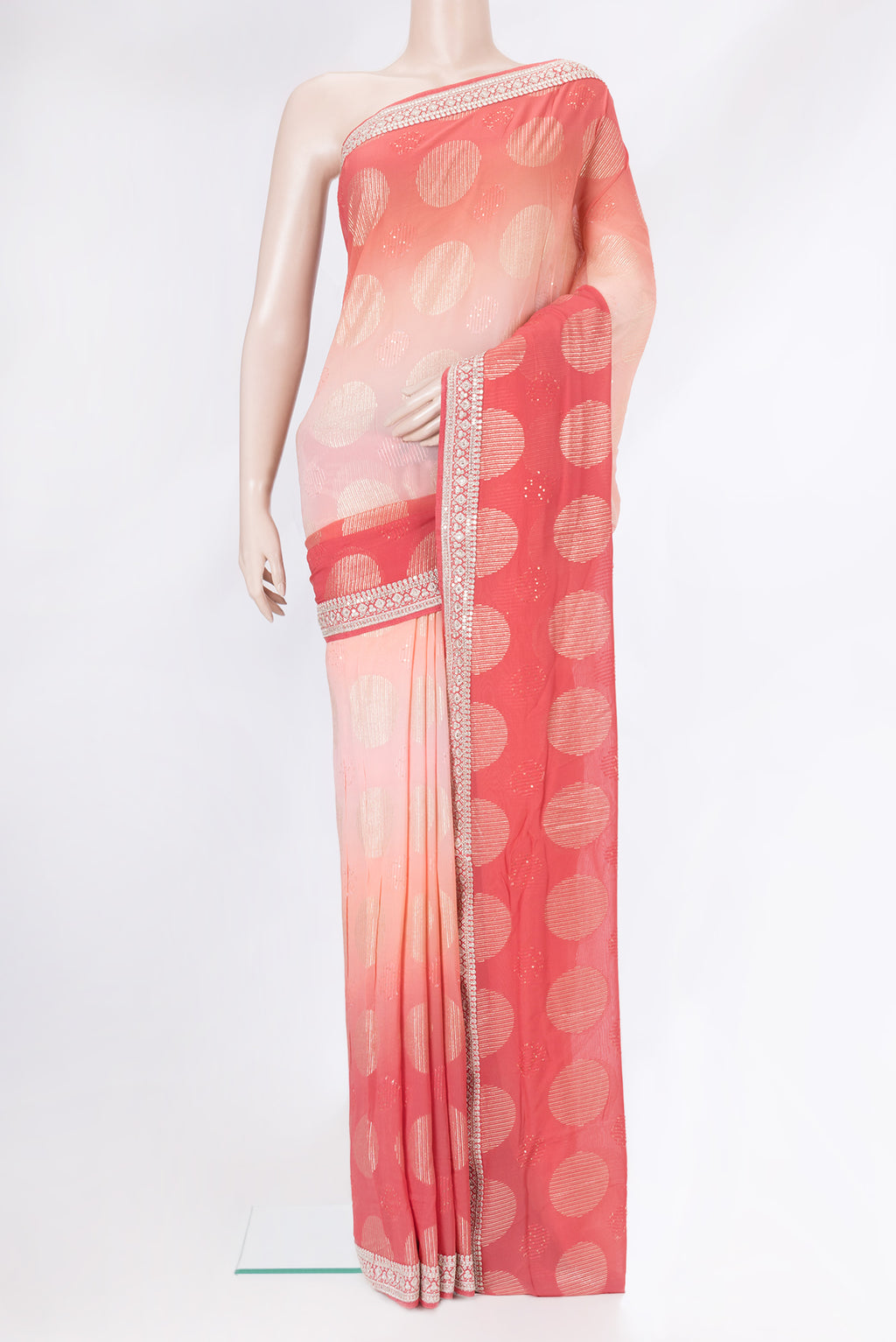 Golden Peach Dual Tone Georgette Saree with Embroidery on the body and Embroidery Border.  displayed on a mannequin
