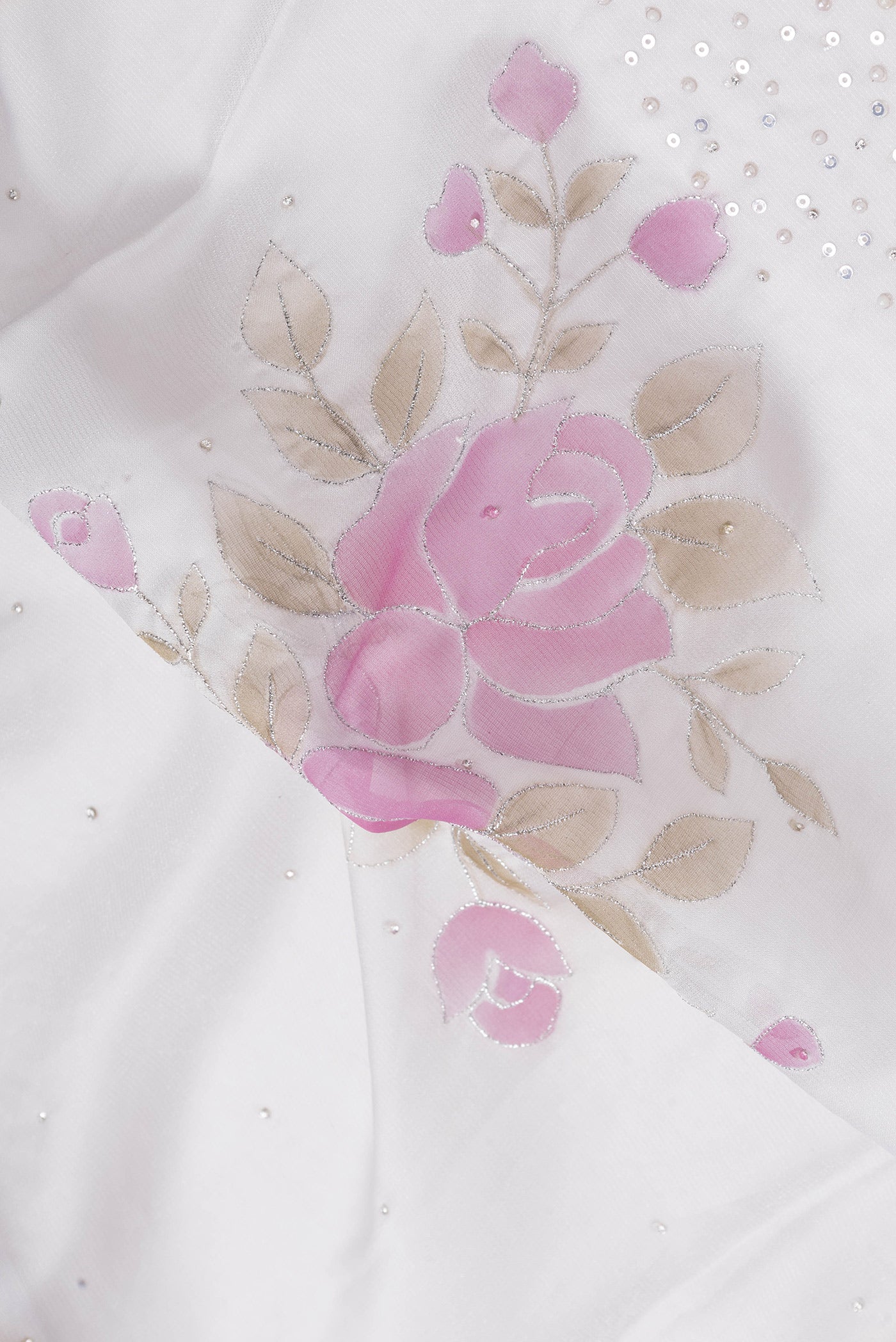 Close up of Grey Dual Tone Georgette Saree with Embroidery on the body and Embroidery Border.  displaying folds