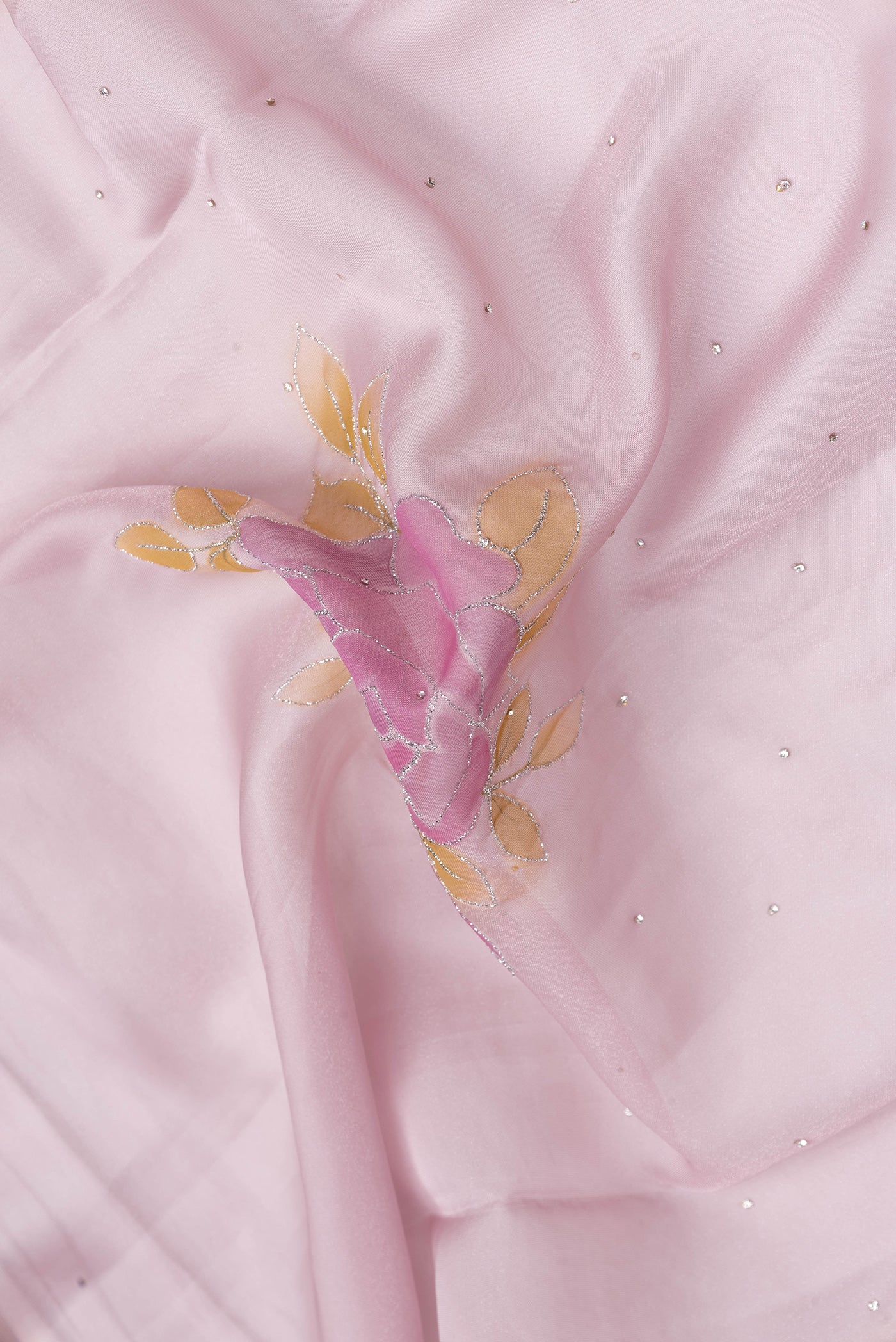 Close up of Pink Dual Tone Georgette Saree with Embroidery on the body and Embroidery Border.  displaying folds