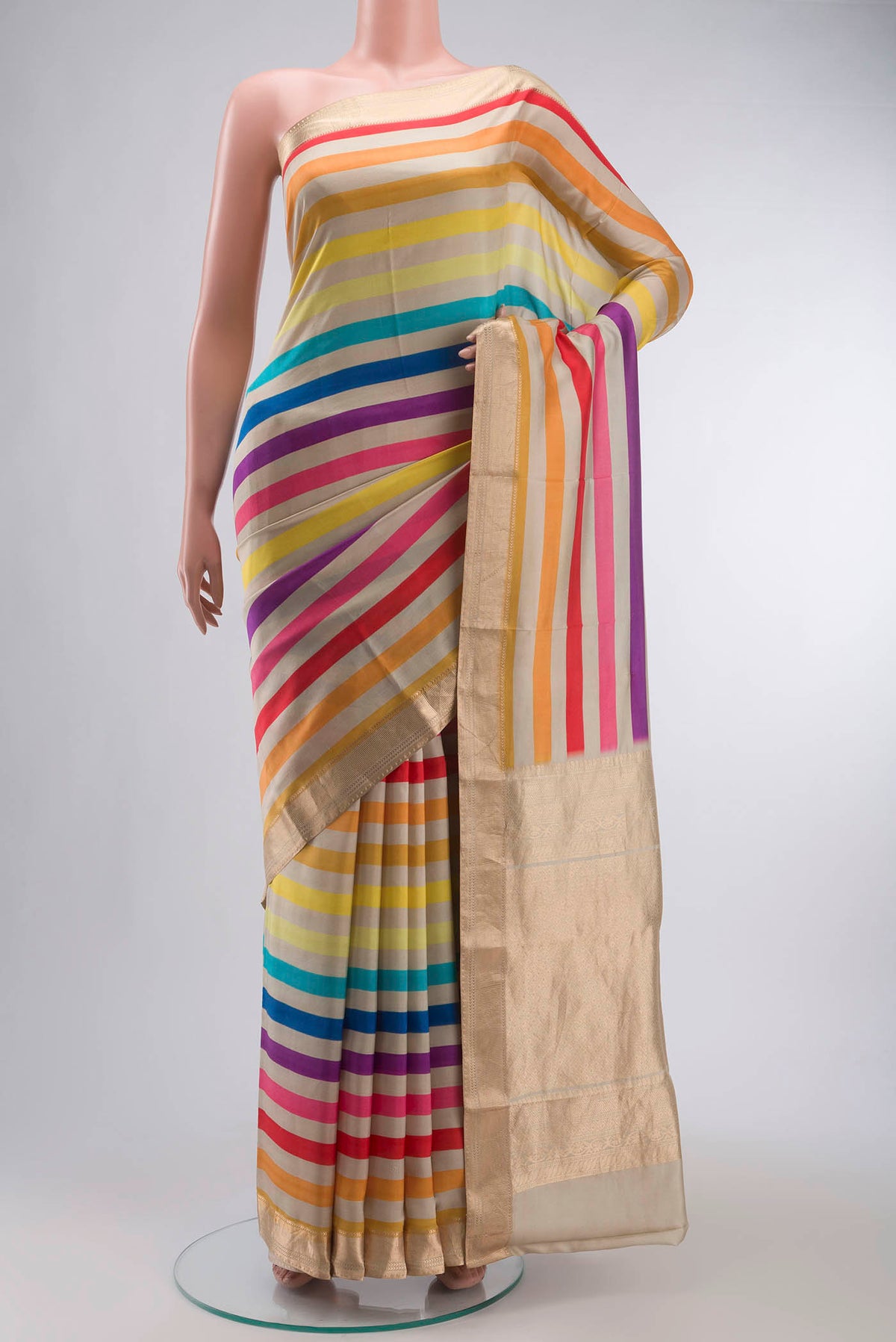 Multi Color Printed Silk Saree with Printed design on the body and Zari Border displayed on a mannequin
